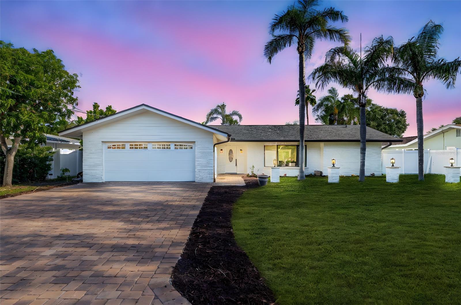 Welcome to 4495 Clearwater Harbor Dr - a beautifully remodeled 3 bedroom plus a den, 2 bathroom, 2 car garage, BLOCK home. Inside, you’ll find a bright split floor plan anchored by a stunning 14-ft quartz island, perfect for entertaining. The custom kitchen boasts ceiling-height soft-close shaker cabinetry, high-end Forno appliances (including French door fridge/freezer, dishwasher, and induction range), a built-in wine rack, and recessed charging stations. Level 5 drywall texture, beveled backsplash, recessed LED lighting, and wide LVP flooring complete the designer look. Some of the other updates include a newer roof (2022), a new HVAC (2025), impact-rated doors/windows (2025), updated plumbing (2024), and a complete remodel from head to toe (2025). Relax in the true primary suite with an oversized walk-in closet and a private outdoor Trex deck enclave. The formal dining room boasts an elegant arched accent wall making it the perfect setting for indoor/outdoor entertaining. The backyard of your dreams with a large pool complete with a pool bath. Bonus features include a dedicated laundry room, new 6-ft vinyl privacy fencing, water views from the living room through the big bay window, and architectural landscape lighting. Don’t delay. Call today, and be the envy of family, friends, and neighbors! SELLER OFFERING INTEREST RATE BUY DOWN!