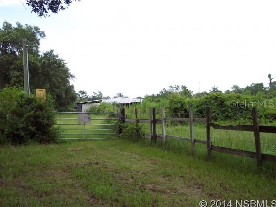 DIRECT ROUTE TO THE BEACH.NICE CORNER PARCEL CLOSE TO BUSY SR#44 AND CAUSEWAYSUBDIVIDABLE LARGE PARCEL IS MOSTLY FENCED WITH SMALL BARN.PREVIOUS HOUSE WS TORN DOWNARTESIAN WELL, WELL, SEPTIC AND ELECTRIC ON PROPERTYALSO INCLUDES PARCEL #741900000101; Cleared: Partial ;Water: Available at Site