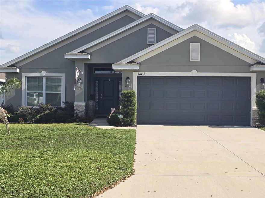 Like New & NO CDD! – Modern Elegance in Countryside
Discover the perfect blend of contemporary design and smart savings! This immaculate 2022-built residence (Adams Homes' popular "1820A" model) offers the peace of mind of a new construction without the extra burden of CDD taxes. Located in the desirable Countryside subdivision, this 4-bedroom, 2-bathroom home is move-in ready and waiting for you.

Key Features & High-End Finishes
Open Concept Living: A fluid 1,820 sq. ft. floor plan featuring vaulted ceilings and 5 ¼” baseboards throughout for a spacious, premium feel.

Chef’s Dream Kitchen: Boasts 36” custom wood cabinets with crown molding, stainless steel appliances (glass-top range, microwave, refrigerator and dishwasher) and a central island perfect for hosting.

Private Master Retreat: Spacious bedroom with an en-suite bath featuring dual vanities, a separate walk-in shower, and a soaking tub.

Energy Efficiency & Quality: Stay cool with a high-efficiency 15 SEER A/C system. The home also includes hurricane shutters and a built-in pest control system.

Outdoor Living: Enjoy your morning coffee on the 10x14 covered lanai, overlooking a yard perfect for pets or play.

Unbeatable Location & Financial Benefits
NO CDD Fees: Save significantly on your monthly payment—a rare and massive advantage for a newer home in Dade City!

Low HOA: Just $80/month covers community maintenance.

Prime Accessibility: Located only 1.3 miles north of the Clinton Ave and Hwy 301/98 intersection. Close to shopping, dining, and the historic charm of downtown Dade City.

Safety First: Situated in Flood Zone X and built with sturdy concrete block construction.

Ideal for Every Buyer
For Families: Plenty of room to grow with 4 dedicated bedrooms and a safe, quiet neighborhood setting.

For Investors: A low-maintenance, high-demand rental opportunity in a growing area with minimal carrying costs.

Don't miss out on one of the best values in Pasco County. Schedule your private showing today!