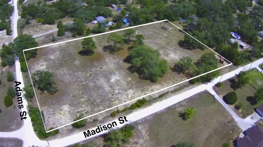 Exceptional opportunity to own 2.4 acres of prime, mostly cleared corner lot land at the corner of Madison and Adams in one of Hernando County's most sought-after locations! Zoned Agricultural, this flat, build-ready parcel offers incredible versatility — whether you're envisioning your custom dream home, a hobby farm, or a long-term land investment. With just a few mature trees adding natural character, the hard work is already done. Well and septic will be needed, giving you the freedom to design your utilities to suit your needs. Enjoy unbeatable convenience with quick access to the Suncoast Parkway, plus a wide array of restaurants, shopping, and everyday amenities just minutes away. Corner lot location provides added visibility and multiple access options. Don't miss this rare chance to secure your piece of Florida's growing landscape — properties like this don't last!