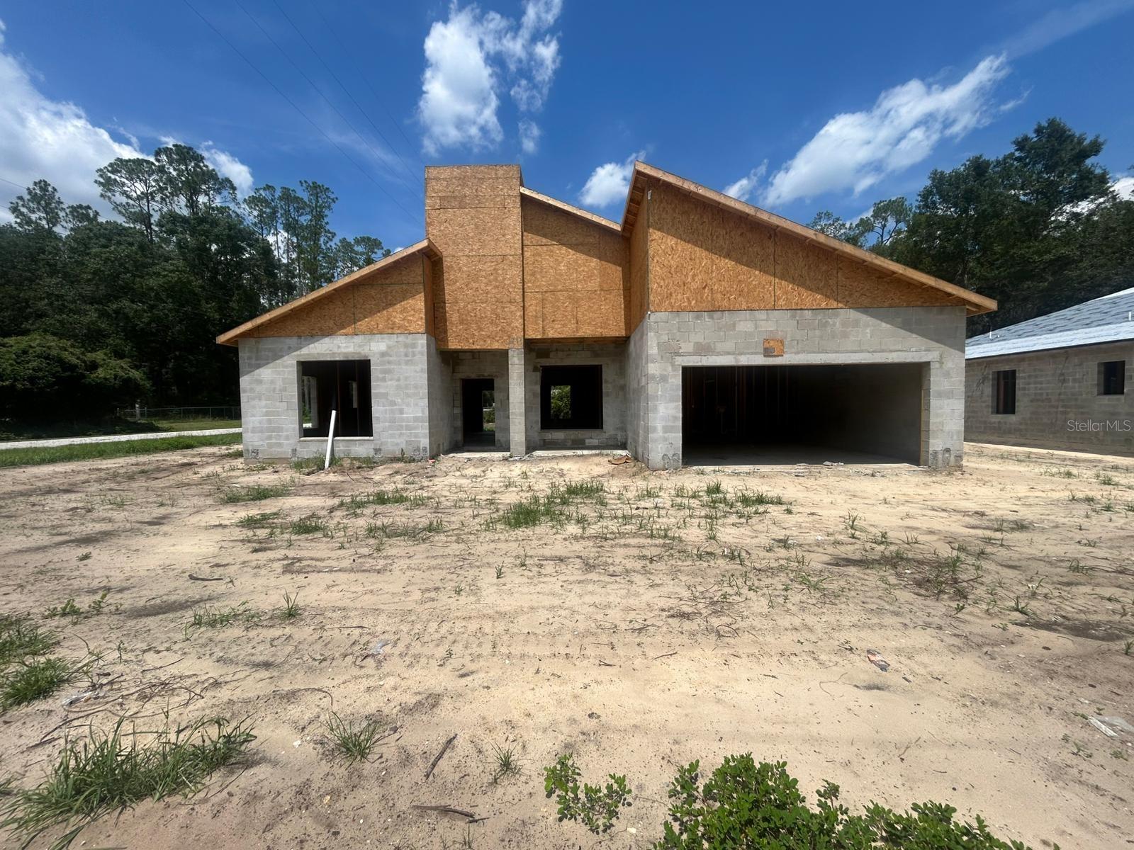 Under Construction. Estimated delivery October 2025*** New Construction in Dunnellon, FL! This modern 3-bedroom, 2-bathroom home with a 2-car garage is located in the highly sought-after Rainbow Lakes Estates community — with NO HOA and NO CDD. Situated on a spacious lot in a quiet area, surrounded by nature, offering the freedom and space you’ve been looking for. NO flood zone. Includes refrigerator, oven, stove and garbage disposal
The property features a contemporary open-concept design, a split floor plan for added privacy, an integrated kitchen with a breakfast bar, indoor laundry room, and quality finishes throughout. Perfect for families, first-time homebuyers, or those seeking a peaceful retreat in rural Florida.
Prime location! Just minutes from the breathtaking Rainbow Springs State Park and the crystal-clear Rainbow River, as well as being close to the Equestrian Center and with easy access to US-41, offering excellent connectivity to Ocala, Crystal River, and more.
Enjoy a vibrant community with access to parks, lakes, sports courts, recreational areas, and walking trails. A natural and relaxed environment, with no association fees or restrictions.
Financing available: FHA, VA, and conventional loans. Don’t miss this opportunity to own a brand-new home in one of the fastest-growing areas of Marion County!
*The photos show the renderings and the progress of the construction.