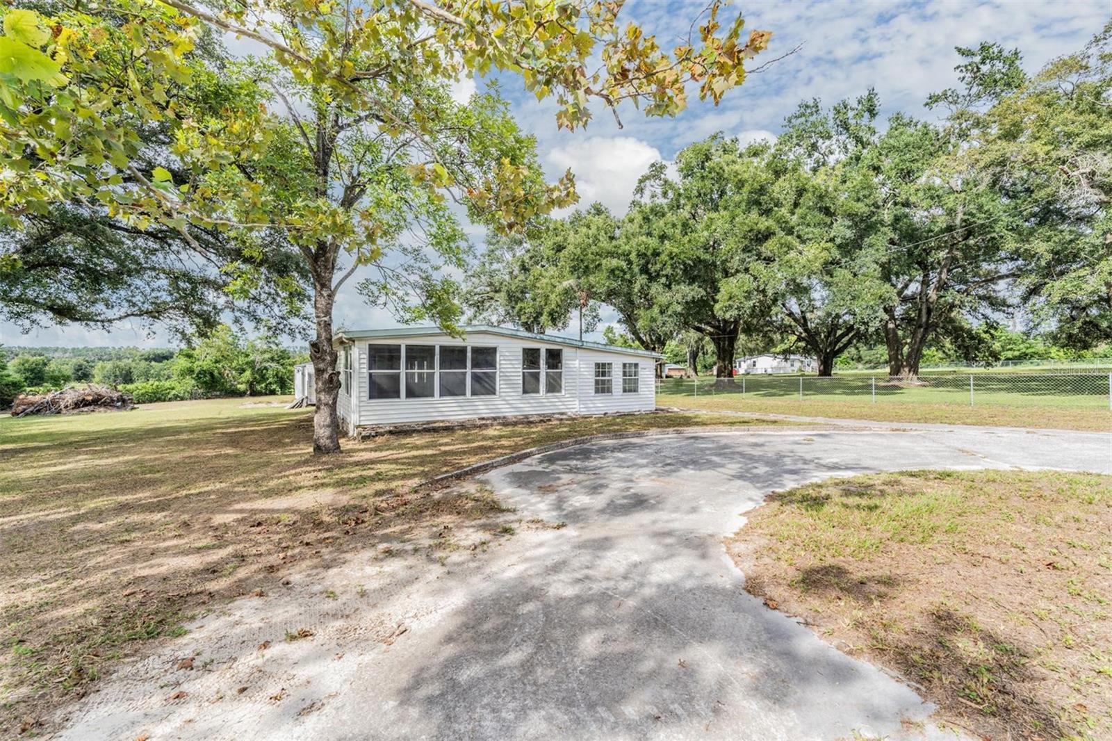 Discover a unique opportunity to create your dream property in the heart of Zephyrhills. Set on a spacious lot, this 2-bedroom, 1-bath home offers the framework to be rebuilt or reimagined to your taste. The structure has been taken down to the bones, providing a clean slate for investors, renovators, or visionaries ready to bring it back to life.
What truly sets this property apart is the massive steel garage, large enough to accommodate up to 5 vehicles. Complete with workshop space and shelving, it’s an ideal setup for hobbyists, mechanics, or anyone in need of serious storage. An additional shed provides even more flexibility for tools or equipment.
Surrounded by greenery and mature trees, the lot provides privacy, fresh air, and room to expand. Whether you’re seeking a project or simply need extensive garage space in a peaceful setting, this property offers plenty of potential.
Don’t miss the chance to transform this Zephyrhills home into exactly what you envision.