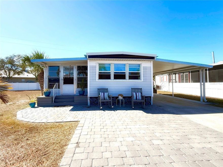 No lot rent, HOA, or CDD—just a low monthly maintenance fee. This fully furnished, move-in-ready 1-bedroom, 1-bath home offers an easy, coastal lifestyle in a gated, resident-owned 55+ waterfront community with canals leading directly to Tampa Bay. The home has been thoughtfully updated with all new flooring and completed subfloors, plumbing upgrades, new skirting, a new vapor barrier, added insulation, a metal roof, and updated living room windows. It offers 714 sq. ft. of interior living space, plus a spacious add-on room that flows into a storage area, providing an additional 204 sq. ft.—perfect for hobbies, guests, or relaxed Florida lounging. Inside, the home feels bright and welcoming, with a stacked washer and dryer conveniently located in the hallway, a bathroom with a step-in shower and linen storage, and a comfortably furnished bedroom ready for immediate use. Enjoy a waterfront-adjacent lifestyle with access to a heated pool, clubhouse, social activities, and outdoor amenities including boating, kayaking, shuffleboard, bocce, and horseshoes. Ideally located between Tampa and Sarasota/Bradenton, this home places beaches, dining, and day-trip adventures within easy reach. The ownership share is included with the sale, making this an effortless transition into relaxed Florida living.