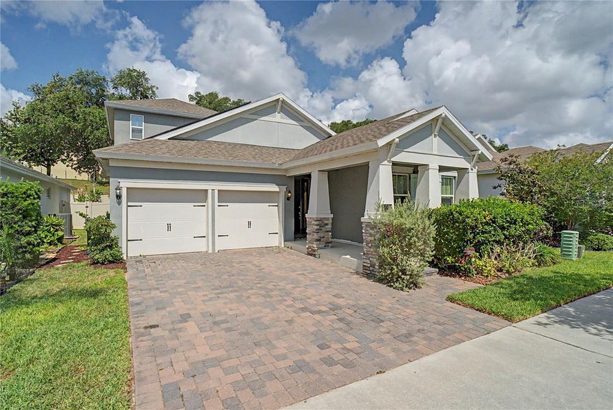 One or more photo(s) has been virtually staged. BETTER THAN NEW WITH FULLY PAID-OFF SOLAR PANELS AND WHOLE-HOME WATER FILTRATION SYSTEM AT CLOSING! Beautifully designed 4-bedroom, 3.5-bath home with a bonus room upstairs featuring a walk-in closet and full bathroom, ideally located in the highly desirable Hamlin area of Winter Garden. Situated on a premium lot with no rear neighbors, this home offers both privacy and convenience in one exceptional package.

The welcoming bungalow-style exterior opens to a spacious, modern interior filled with upgrades throughout, including soaring ceilings, tall doors, premium windows, designer lighting, custom Bali window shades, huge closets, and a downstairs laundry room. The thoughtfully designed split-bedroom floor plan offers privacy and functionality, with the main living areas and bedrooms located on the first floor, while the upstairs bonus room provides incredible flexibility as a guest suite, media room, office, or additional living space.

The gourmet kitchen features a massive island, quartz countertops, stylish backsplash, range hood, and walk-in pantry, all overlooking the open living and dining spaces, making it ideal for entertaining and everyday living.

Step outside to the covered rear porch and enjoy the fenced backyard with no rear neighbors and room for a future pool.

Additional highlights include fully paid-off solar panels and a whole-home water filtration system, both to be paid off by the seller at closing.

Conveniently located near Hamlin Town Center, SR-429, Walt Disney World, Orlando International Airport, shopping, dining, and major attractions, this home is zoned for Hamlin Elementary, Hamlin Middle, and Horizon West High School. This is Florida living at its finest.