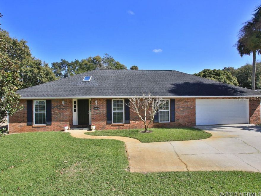 Beautiful brick pool home in sought-after location between US-1 and the river.  Walking distance to schools, the public library and Intracoastal waterway.  Features impact/wind rated windows, skylights and garage door (for lower insurance premium), extra large screened lanai looking out to a spacious fenced backyard and in-ground pool.  This 3 bedroom, 2 bath home is a split plan with hardwood flooring throughout the living area.  A vaulted ceiling and wood burning fireplace in the family room which is open to the kitchen.  Extra large 23 x 13 dining room/living room combo.  Space on side of house for a boat or RV parking, includes electric and sewer hookup.  Natural gas available for pool heater or gas appliances if desired.  Brick exterior makes maintenance carefree.  Storage shed is wired for 50 amp service to run a generator for the house.  Well sprinkler system.  City water and sewer.  Pool re-surfaced and pavered decking in 2013. ;Water: City