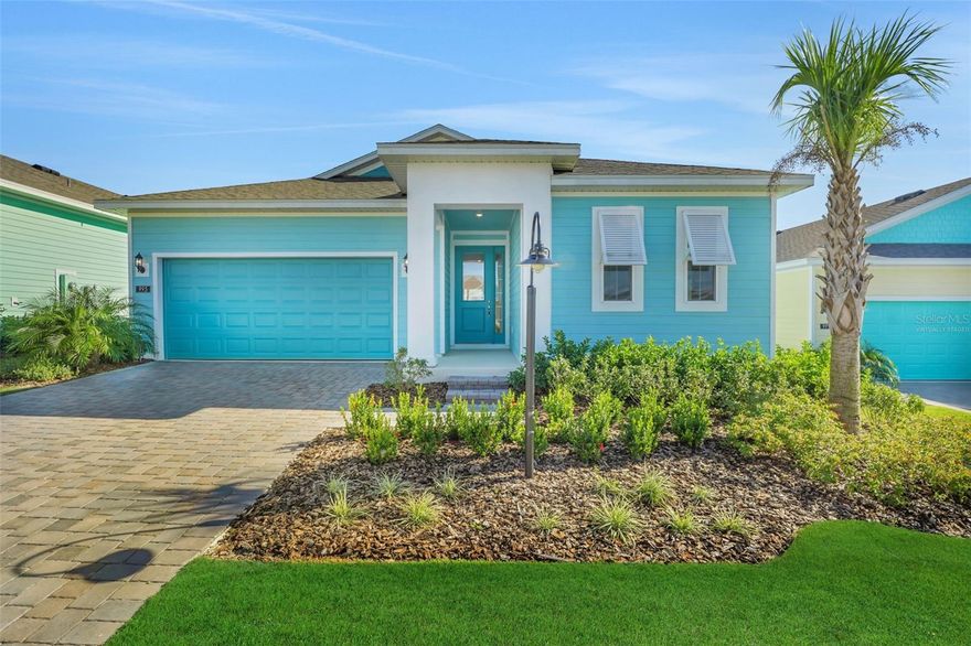 One or more photo(s) has been virtually staged. This Key West Style Lexington Plan is a roomy 3 Bedroom 2 Bath with a Tandem Garage to allow extra space for lawn equipment, a golf cart, or a 3rd car! Open Concept Kitchen/Living/Dining area with 5.25 inch baseboards, 8ft doors, and a beautiful 8' Slider leading to the Covered Lanai. The kitchen has a Center Island with Quartz countertops and upgraded 42" Linen Cabinets. All living areas have upgraded Plank Tile Flooring. Master Suite complete with an oversized Walk-in Closet. Spacious Laundry Room. Brick Pavers on the Drive and Walkway, and the Key West styled exterior give it the special touch!