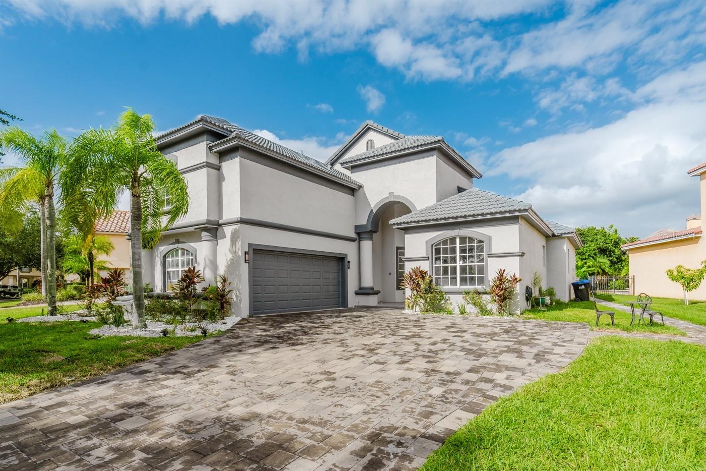 Stunning residence with a private fenced backyard, located in the highly sought-after gated community of Belmere in Windermere, just minutes from the town center. Featuring 4 bedrooms, 4 bathrooms, and approximately 2,800 sq. ft. of air-conditioned living space, this home immediately captivates with its elegant Mediterranean architecture and lush tropical landscaping.
Fully renovated this year, the home features new flooring, a kitchen, bathrooms, and both interior and exterior paint, perfectly combining technology, comfort, and sophistication. The integrated sound system extends throughout the house, while the gourmet kitchen impresses with a ceramic range, built-in refrigerator, quartz countertops, and LED lighting. Motorized cabinets, a built-in oven and microwave, a large pantry, and a sink with a glass washer complete this space designed for culinary enthusiasts. Also, a state-of-the-art whole-house water filtration system is installed at the main water line, treating all the water that enters the house.
A newly constructed deck is ready for the installation of an oversized jacuzzi, with all plumbing already in place. Additional features such as touch-activated LED stair lighting and vitrified epoxy-coated garage flooring further elevate the living experience.
The home offers spacious, bright, and contemporary living areas. The family room, filled with natural light, opens directly to the outdoor area, creating a seamless connection between indoor and garden spaces. The expansive and elegant kitchen serves as the heart of the home, ideal for family gatherings around the central island.
The master suite is a true private retreat, offering serene garden views and a luxurious bathroom featuring a soaking tub, the perfect spot to unwind after a long day.
The outdoor area provides a tranquil and inviting setting, ideal for family gatherings or moments of peace surrounded by nature. The outdoor kitchen also provides a 6-burner gas stove, gas grill, sink, and a mini refrigerator.