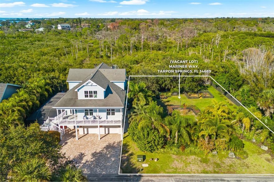Experience the ultimate waterfront lifestyle in the exclusive gated enclave of Mariner Village in Tarpon Springs. This rare 0.28-acre (12,070 sq ft) lot offers 85 feet of pristine creek frontage with direct water access and breathtaking south-facing views that capture sunlight and serenity throughout the day. The property provides a blank canvas for a custom-built home, perfectly positioned to embrace the tranquil waters and the natural beauty of the surroundings. Residents enjoy a meticulously maintained private road network, deed-restricted community standards, and a nearby private marina offering boat slips for vessels up to 36 feet (first come - first serve), ensuring effortless access for boating enthusiasts. Utilities, including public water and sewer, are readily available, with electrical service nearby, simplifying the path to construction. Nestled within a strong Pinellas County school district, the lot is close to Sunset Hills Elementary, Tarpon Springs Middle, and Tarpon Springs High, combining lifestyle with convenience. With modest quarterly HOA fees of $408, this property delivers an unparalleled opportunity to create a distinctive waterfront retreat that balances privacy, elegance, and unmatched community amenities.