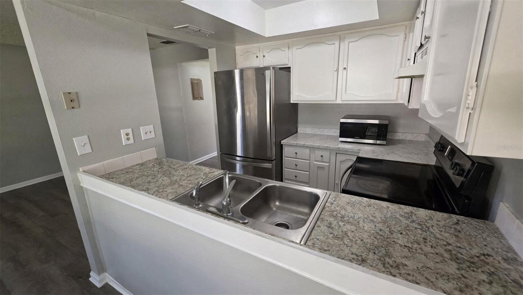 Photo of 1802 Barton Drive #1, Kissimmee, FL 34741 (MLS # S5159525)