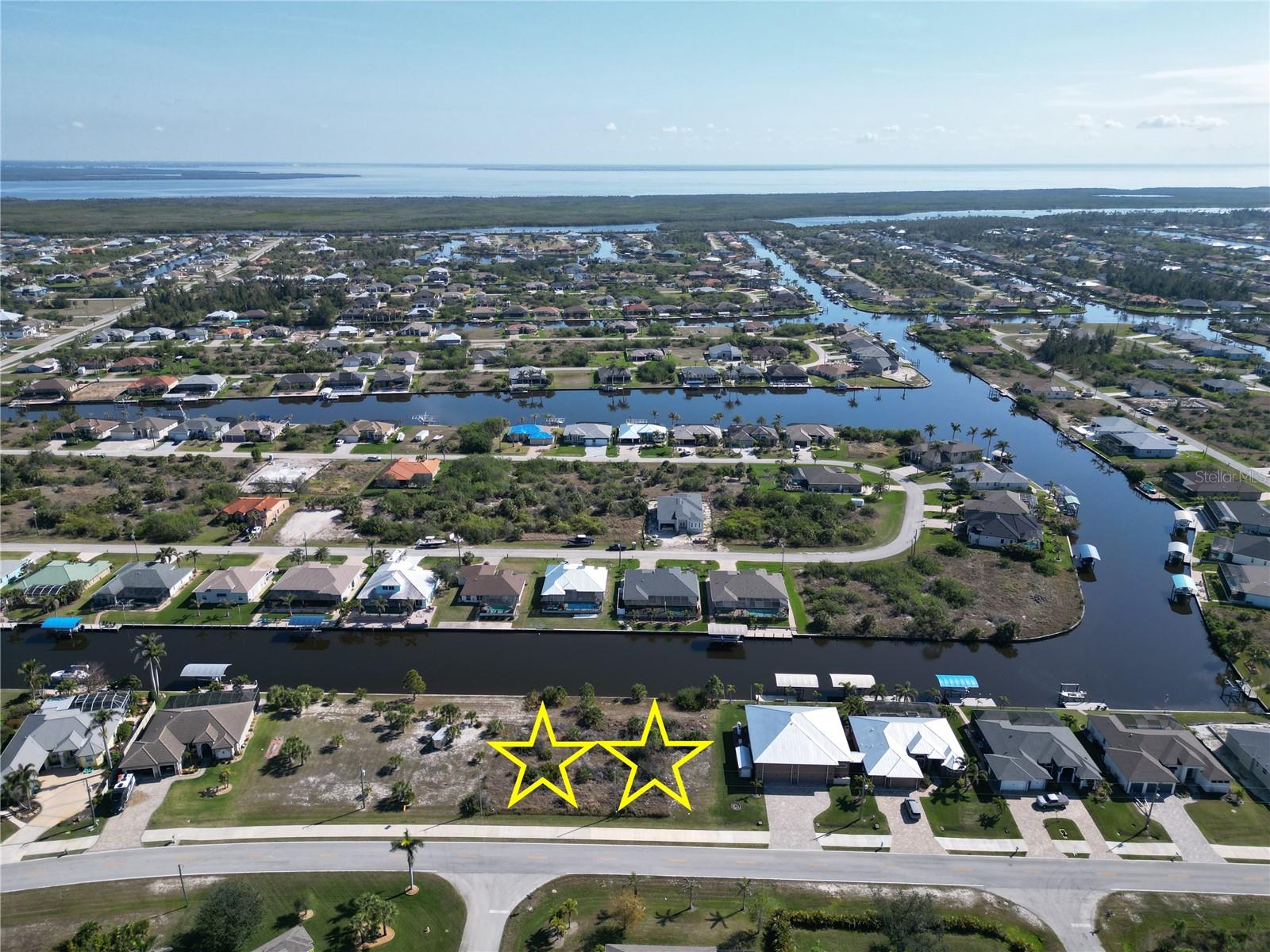 Double Lot For Sale with 160 feet of concrete seawall making this a Boaters Dream not the mention it's only one bridge out to the Charlotte Harbor and the Gulf of Mexico. The property is 160 x 125, so being roughly 1/2 acre gives you plenty of space to place your home on the property. This gives you the ability to build a larger home & pool or possibly a detached structure for your toys. Water, Sewer and Electric are all run to the property and ready for hook up making building a breeze. The community has an optional HOA that is only $120 annually. The community offers multiple parks, playground, sidewalks, public boat ramp and over 50 miles of navigable waterways for your boating enjoyment. The property is 20 minutes to the beaches on Boca Grande Island or Manasota Key, 15 minutes to shopping / dining and 10 minutes to over six semi-private golf courses. Double lots with a seawall are very hard to find, so don't let this one get away. Secure Your Piece of Paradise Today...