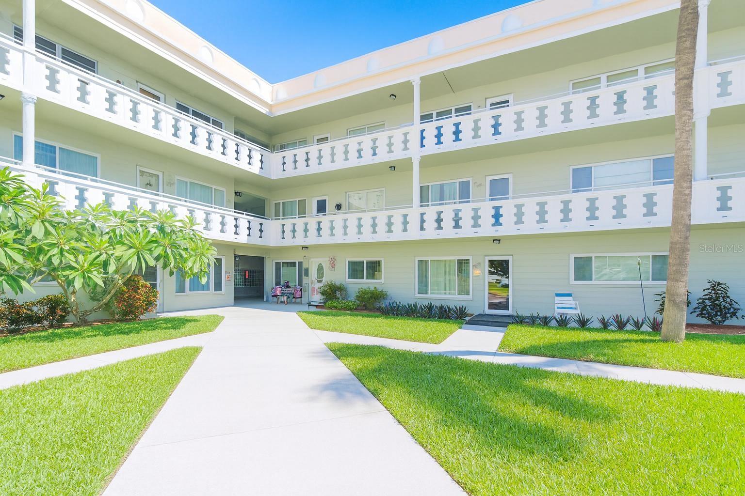 Welcome to your spacious 2-bedroom, 2-bath condominium with over 1,400 sq. ft. of comfortable living space, ideally situated in the highly desirable On Top of the World 55+ community. SELLER FINANCING AVAILABLE! This inviting second-floor unit is located directly across from the east side activity center, where you’ll enjoy a swimming pool, tennis courts, fitness center, BBQ pavilion, and more. Elevators or stairs may be used for this 2nd story access.
Inside, the home features a bright kitchen with shaker-style cabinets, granite countertops, recessed lighting, decorative shelving, and a full appliance package. Easy-care luxury vinyl plank flooring flows through the main living areas, with carpet in the bedrooms for added comfort. Both bathrooms have been tastefully decorated with updated vanities, lighting, and commodes. A convenient in-unit washer/dryer combo—tucked into a dedicated laundry closet—adds to your ease of living. Other highlights include neutral paint tones, updated baseboards, cordless window blinds with double-molded trim, and modernized electrical switches and outlets. Major systems such as the HVAC, water heater, and windows were updated in recent years, giving peace of mind. Assigned parking included.
The On Top of the World community offers unparalleled amenities: two private golf courses (9 and 18 holes) free to residents, two swimming pools (one heated), a state-of-the-art cardio gym, hobby studios, a woodworking shop, billiards, cards, dancing, clubs, fitness classes, entertainment, and more. A dog park with shaded seating makes it very pet-friendly, and the on-site Good Karma Café is a great spot for snacks or take-and-bake meals. All of this, just minutes from world-class beaches, shopping, dining, and entertainment.
This property is being transferred by leasehold estate deed. Association approval required. All room sizes and square footage are approximate.