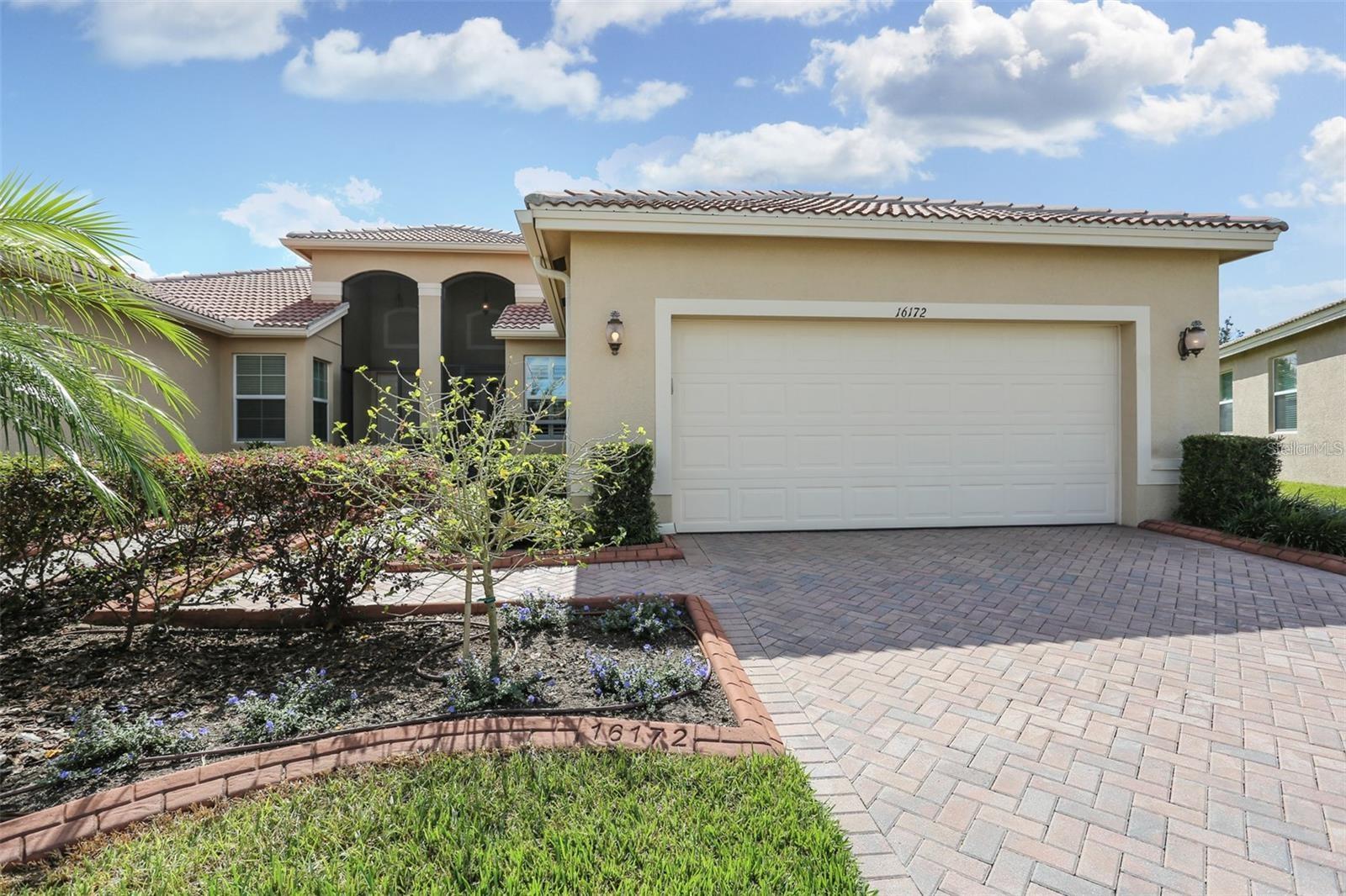 This well-maintained Sophia model villa, built in 2010, offers 1,519 square feet of comfortable living space and is perfectly situated on a pie-shaped lot with peaceful, serene views. Located in the highly desirable Valencia Lakes 55+ community, this home is ideal for those seeking both elegance and an active lifestyle.
Inside, you’ll find tile flooring throughout—no carpet—paired with a neutral color palette that complements any décor. The open-concept floor plan includes two bedrooms and a den, which can easily serve as a third bedroom or office. The spacious kitchen has been thoughtfully extended and features granite countertops, a new Bosch dishwasher, a French door refrigerator, a double oven range, 42-inch maple wood cabinets, and a custom-built corner bench with hidden storage in the breakfast nook.
The primary suite includes a large walk-in closet with built-in organizers and an en-suite bath with double sinks and a seated shower. The living area flows seamlessly onto an extended, brick-paver screened lanai, offering a tranquil outdoor retreat with lovely views.
Additional upgrades throughout the home include plantation shutters, designer lighting, ceiling fans, a water softener, reverse osmosis system, security system, and a convenient garage outlet.
Valencia Lakes is a premier 55+ gated community offering a true resort lifestyle with pools, a 24-hour fitness center, café dining, entertainment, social clubs, sports courts, exercise classes, a Veterans memorial, a softball field, and so much more. Ideally located close to Tampa and Orlando attractions, beautiful Gulf beaches, shopping, dining, and easy access to I-75, this home offers the perfect blend of comfort, convenience, and community.
Live and play like you’re on vacation every day!