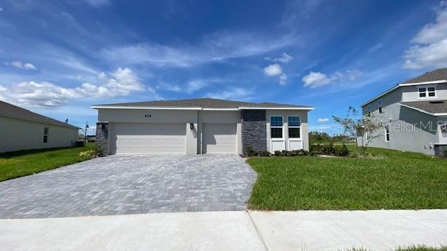 Move-In Ready! Discover the perfect blend of comfort and elegance in the Serenity plan, situated on a beautiful oversized homesite, and offering 4 spacious bedrooms, 3.5 baths, Media Room, and a 3-car garage in an open-concept layout ideal for modern living. The stunning kitchen is a chef’s dream, featuring 42" upgraded white cabinets, quartz countertops, a stylish tile backsplash, stainless steel appliances with built-in oven, cooktop and range hood, a large island, and an oversized walk-in pantry. The expansive Great room flows seamlessly to the Dining area which opens to a 30' wide covered Lanai, perfect for indoor-outdoor entertaining. Beautiful tile flooring flows throughout the home, while the large Primary suite offers a true retreat with separate vanities, granite countertops, shower with upgraded wall tile surround, and an oversized walk-in closet. Storey Creek offers outstanding amenities including Resort style Pool with cabana, Fitness center, Tennis, Basketball, and Sand Volleyball courts, playground, walking trails, and dog park. Conveniently located near restaurants and shopping with easy access to major thoroughfares.