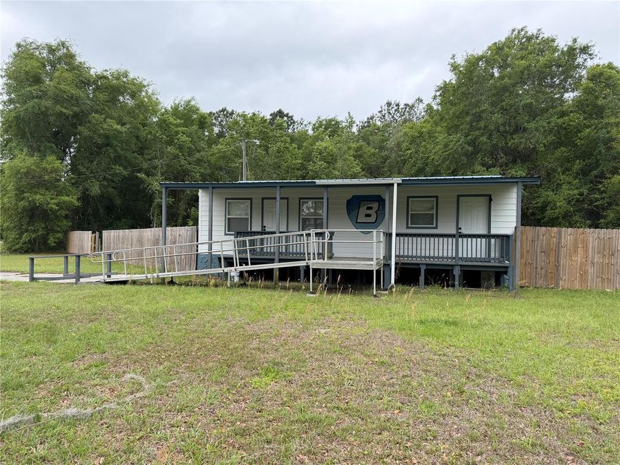 Nice corner lot with 1.56 acres currently zoned commercial C-1. Previously used as a bail bonds office. Existing manufactured building has been updated with interior paint, LVP flooring, led lightning, bathroom fixtures electrical and more! Building has 2 offices, half bath, reception area and large conference/ meeting area/lobby, (no kitchen, no laundry). Steady traffic flow at this intersection make it a great place for your office or business. Parking pad and wheelchair accessible entrance and bathroom are an added bonus. Possible uses include: residential, retail business/office, professional and financial services, hotel, motel, printing/publishing, auto repair (in enclosed building), eating and drinking places. C-2 possibles uses included mobile home sales and repair, food processing and production, laundry, storage facility (in enclosed building). All subject to county approval.