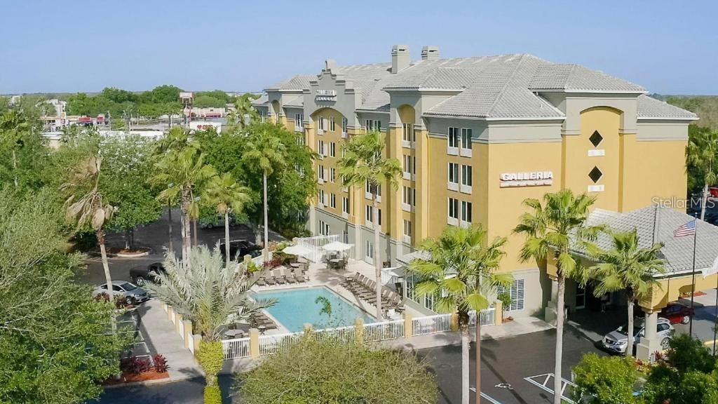 Welcome to this condo/hotel only 2 miles from Disney. This property provides guests with a concierge desk to assist with dining and entertainment reservations, complimentary shuttle service to all your favorite Orlando theme parks, breakfast served daily and free wifi. Hassle-free investment and a place to vacation and enjoy for years to come. Full time on-site property management to take care of everything. Owners can reserve it for a 14 day stay for family or friends. Unit comes with two queen beds, flatscreen TV, kitchenette with mini-fridge and microwave. Newer roof, windows and A/C units have all been recently installed making The Galleria Palms the perfect opportunity to be your 1st investment or a place to stay while in Orlando. Schedule your showing today!