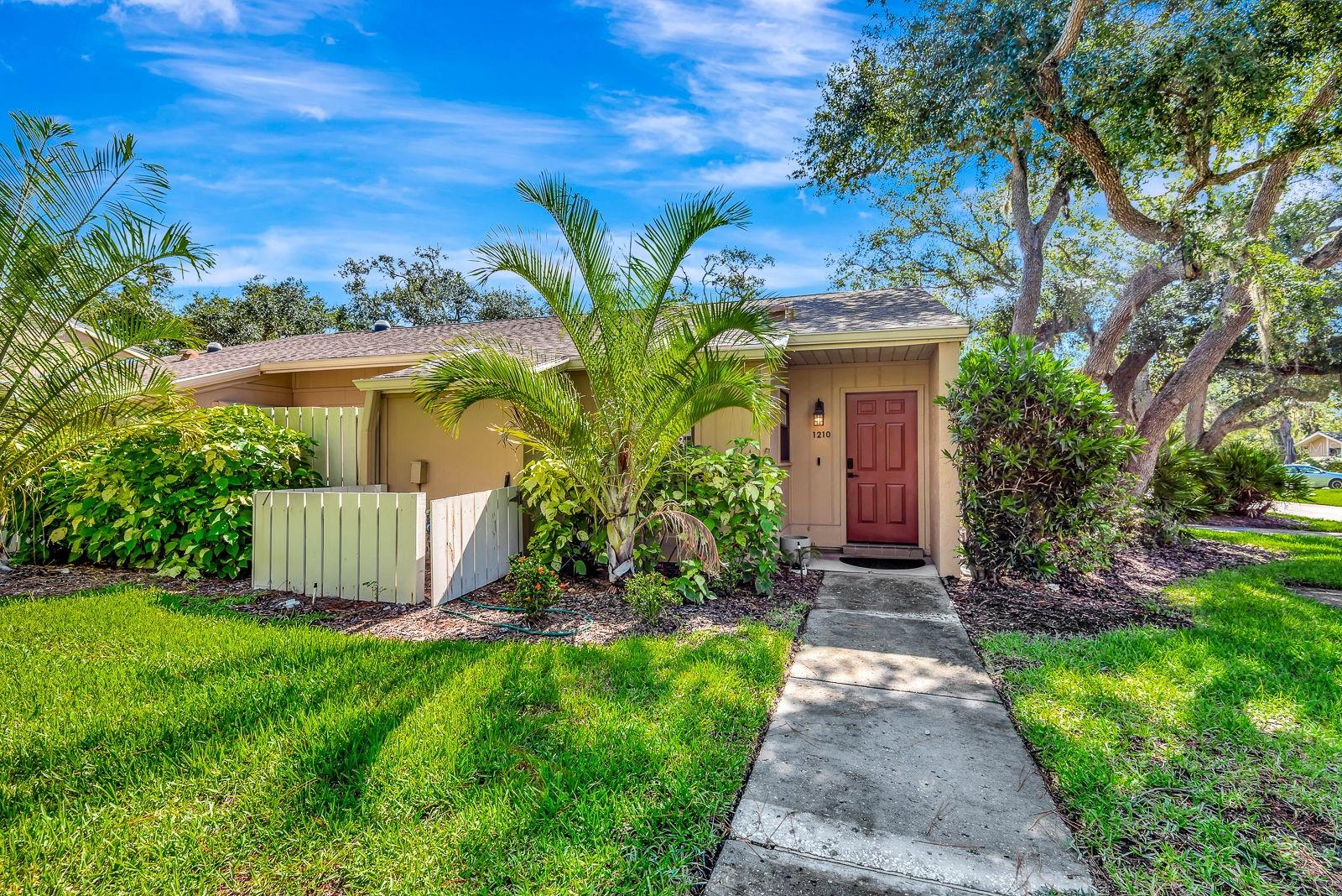 Don't miss this beautifully remodeled 2-bedroom, 2-bath villa in Tallywood, highly sought-after 55+ and pet-friendly community in the heart of Sarasota, Florida. This lovely condo villa offers the perfect blend of tranquility and convenience. You'll be just a short drive away from all Sarasota's wonderful attractions and amenities. Tallywood is a picturesque community, boasting lush tropical landscaping and peaceful, tree-lined streets under a stunning canopy. The villa features a spacious great room and sliders open to a delightful air-conditioned and screened porch that overlooks a grassy, tree-filled common area, perfect for year-round enjoyment. The primary bedroom provides a private en-suite bathroom, a walk-in closet, and sliders that open to the lanai. The kitchen offers plenty of space for a breakfast table, along with sliders leading to a charming patio and a convenient gate to the front lawn. Just steps away is your reserved covered parking. Enjoy all Sarasota's arts, fine dining, shopping, walking trails, parks, and beaches within just a short drive. Residents of Tallywood enjoy access to fantastic amenities, including a clubhouse, heated pool, library, fitness center, shuffleboard courts, and a pet park. This is a vibrant 55+ community with a calendar full of events for its residents. Call today for your private tour!