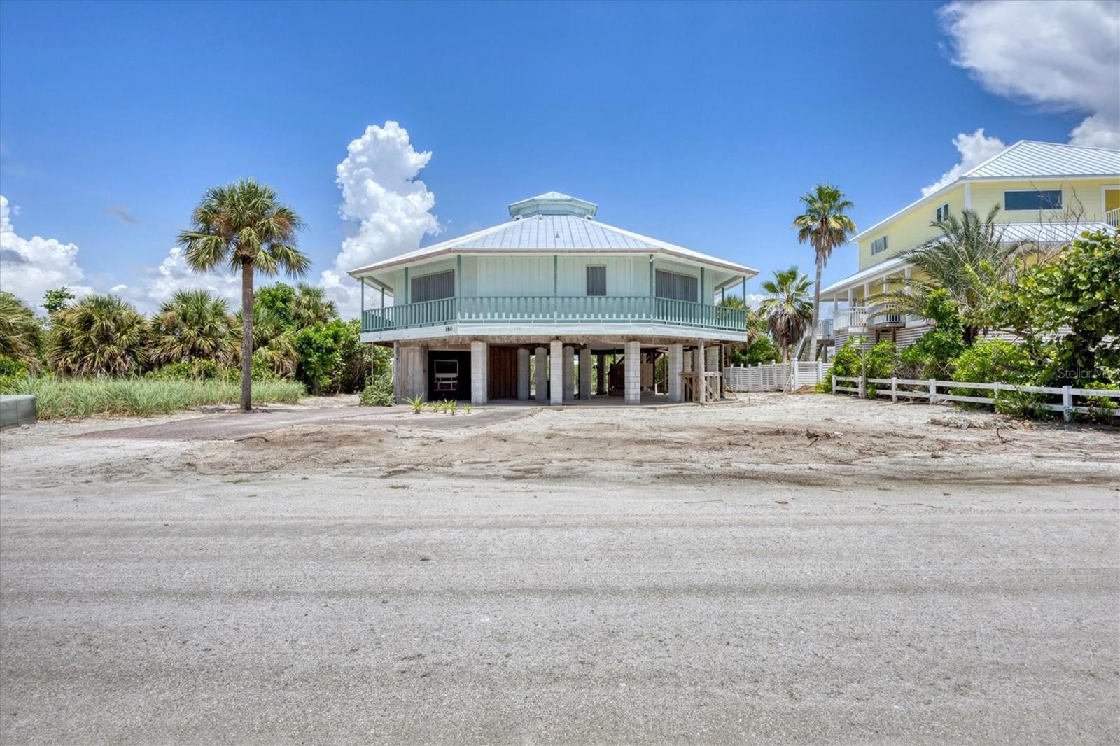If you've been waiting, this is your chance to buy a home on Palm/Don Pedro Island at a great price - THIS IS IT!!
This 2-bedroom 2 bath 1,500 sq ft home offers vaulted ceilings, hurricane shutters and outdoor shower. It is located on Kettle Harbor Waterway which is one of the widest island waterways for great views and no bridges to the ICW and the Gulf of Mexico. There is a boat dock, lift and good boatable water and deeded beach access just minutes away. In 2025 this home had a new metal roof installed as well as electrical panels inside and out and a waterfront staircase. This is a must see.