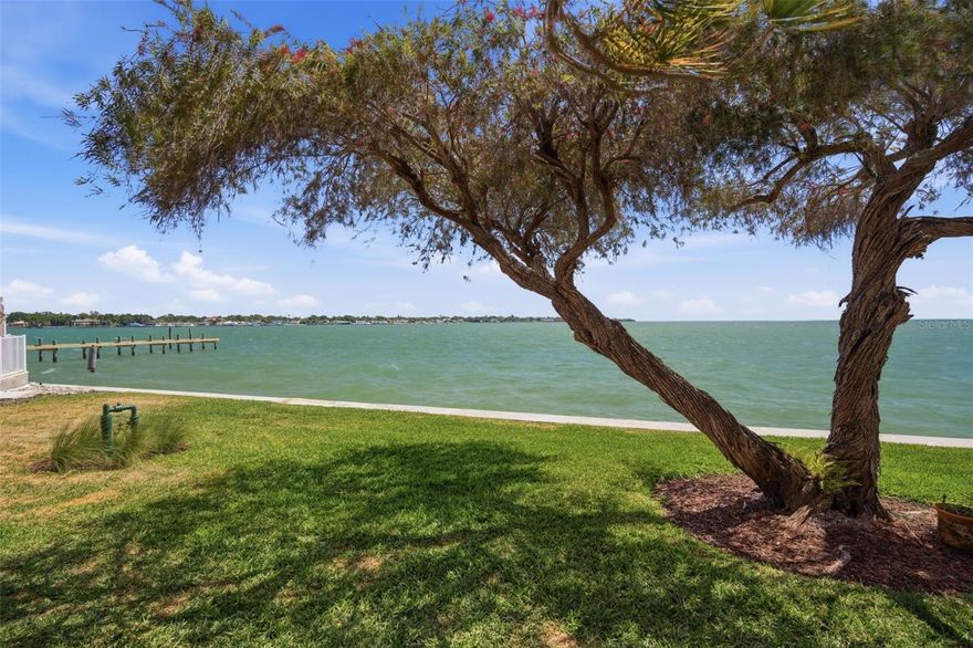 Experience breathtaking, unobstructed wide-open water views of Tampa Bay from this beautifully updated condominium in South Bay Condos. Enjoy panoramic scenery that stretches as far as the eye can see, including a stunning view of the iconic Sunshine Skyway Bridge right from your own home. This spacious 2-bedroom, 2-bathroom unit also offers a versatile third space that can easily be enclosed to create an additional bedroom, office, or den. The thoughtfully designed split and open floor plan provides both privacy and seamless flow, perfect for everyday living and entertaining. Inside, the home has been upgraded with luxury vinyl plank flooring throughout, creating a modern and cohesive feel. The updated kitchen features new cabinetry and opens effortlessly into the dining and living areas, all positioned to maximize the incredible water views. Both bedrooms, along with the main living spaces, showcase these sweeping bay vistas through expansive windows and sliding glass doors. There is an in-unit laundry room for your abundant convenience. Step outside to your private patio, where mature vegetation creates a serene, botanical oasis—an ideal place to relax and take in the coastal breeze. Additional features include installed flood barriers for added peace of mind during storm season. The South Bay community offers a well-maintained inground pool with ample seating, allowing residents to enjoy Florida’s outdoor lifestyle year-round. With unmatched views, thoughtful updates, and exceptional value, this property is truly a rare find.Don’t miss this opportunity—this one won’t last long.