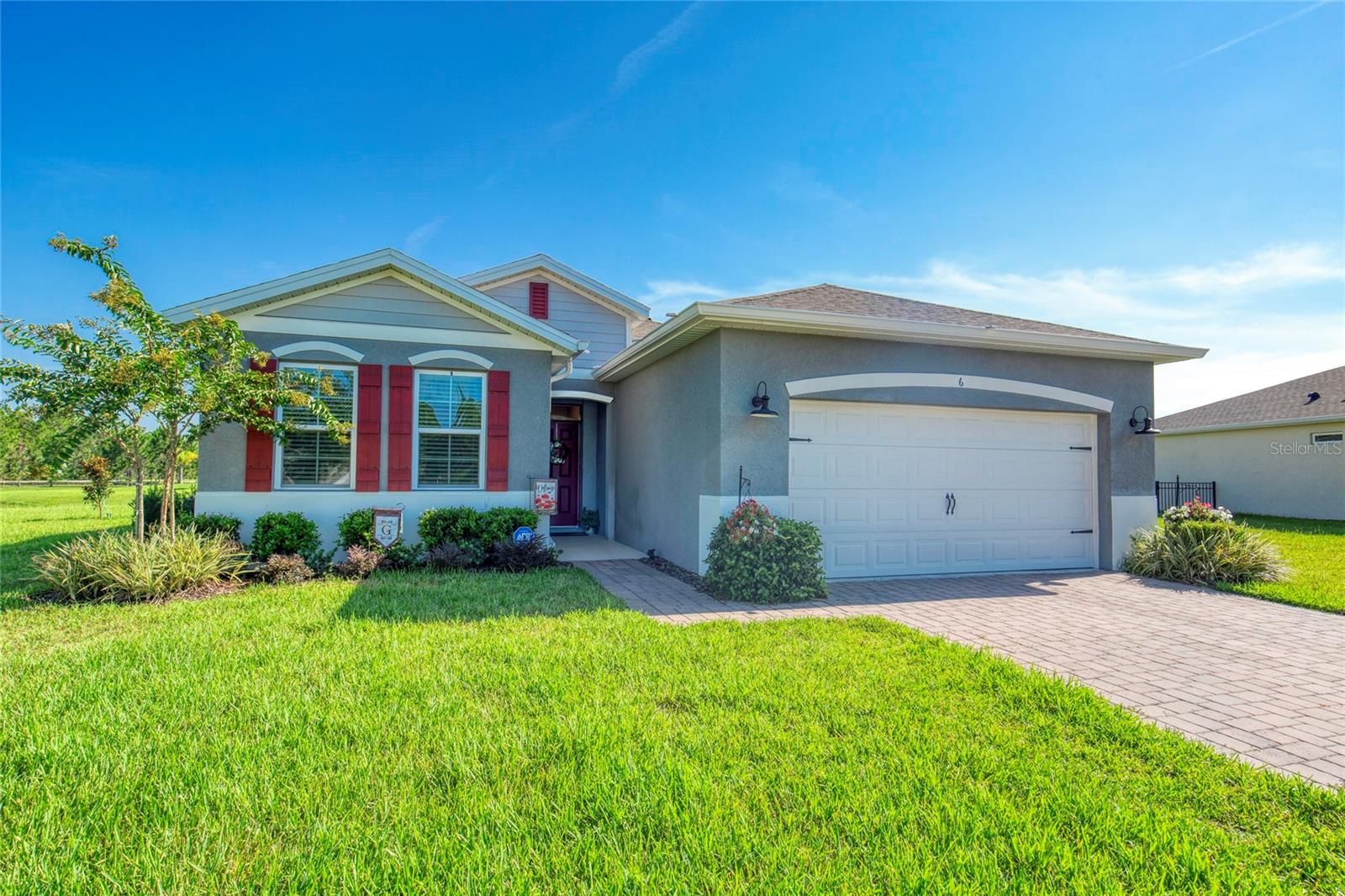 Welcome to maintenance-free living in the beautiful 55+ community of Huntington Green, located in the highly sought-after Hunters Ridge neighborhood of Ormond Beach.
This charming residence features three bedrooms, two bathrooms, and a two-car garage. As you enter, you are greeted by a welcoming entry hall that leads you to the inviting living area into a spacious kitchen, dining area, and Great Room, all adorned with elegant tile flooring. The kitchen is a culinary delight, boasting a generous seven-foot island that serves as a breakfast bar, complemented by stunning granite countertops. Step through the Great Room and onto your expansive 24 x 10 screened-in patio, where you can relax and enjoy serene pond views in your fenced-in outdoor space. This area is perfect for hosting gatherings with friends and family, making it an ideal setting for both entertaining and unwinding. Experience the best of Florida living in this exceptional home!
The homeowners association (HOA) offers a comprehensive quarterly fee that covers a wide array of services and amenities. This all-inclusive package includes lawn care, mulching, cable and internet, pest control, and access to the pool and fitness center, as well as exterior maintenance, which encompasses house painting, pressure washing, and upkeep of common areas. Additionally, the community features a tennis court, a playground, and a second pool, enhancing your recreational options.
Experience the convenience and ease of living in this exceptional community, where every detail has been thoughtfully designed to promote a lifestyle of comfort, relaxation, and enjoyment. This is a remarkable opportunity to reside in one of the most desirable 55+ communities in the area. Don’t miss your chance to make this stunning property your new home!