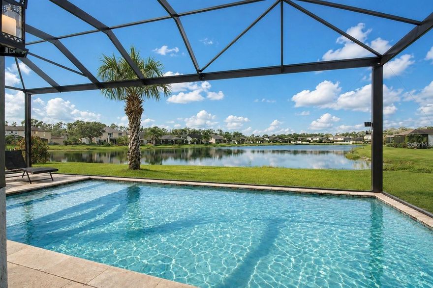 *** MOTIVATED SELLERS *** Welcome to this beautifully maintained and thoughtfully upgraded 5-bedroom, 3-bathroom lakefront pool home on a quiet cul-de-sac in the desirable Cedar Grove community of North Port. Built in 2016 and offering approximately 3,542 sq ft of total area, this spacious home is located in Zone X, where no mandatory flood insurance is currently required.

Designed for comfortable living and entertaining, the bright open floor plan features soaring ceilings, abundant natural light, fresh interior and exterior paint, decorative ceiling details, and Ethernet wiring in every room. The chef-inspired kitchen offers granite countertops, stainless steel appliances, a large walk-in pantry, oversized center island, new refrigerator, and a modern induction convection self-cleaning stove, all opening seamlessly to the great room and screened lanai with peaceful lake and heated pool views from many main living areas.

The thoughtfully designed layout includes 2 bedrooms downstairs and 3 bedrooms upstairs, offering flexibility and privacy for family and guests. The first-floor primary suite features a spacious walk-in closet, natural light-filled dressing area, and spa-style bathroom. Upstairs, a large bonus loft provides flexible space for a media room, home office, fitness area, or playroom, along with additional bedrooms featuring walk-in closets.

Step outside to your own tropical-inspired backyard retreat featuring colorful bougainvilleas, lush banana trees, mature palm trees, and a mango tree surrounding the custom-designed heated pool enclosed within an aluminum screen cage overlooking serene lake views. The outdoor living space offers the perfect blend of privacy, tropical landscaping, and open waterfront scenery for year-round Florida enjoyment.

Additional features include an epoxy-coated garage floor, new garage door opener with battery backup power, generator pre-wiring in the garage, portable generator with connection cable included, steel overhead storage racks, and rare additional parking space.

Cedar Grove residents enjoy a covered fenced playground and key-access heated community pool with restrooms. This home offers lower HOA fees because homeowners maintain their own lawns, unlike other sections with mandatory lawn maintenance. The home also includes direct mail delivery service, a rare neighborhood convenience.

Conveniently located near I-75, shopping, dining, golf, Venice beaches, and world-famous Siesta Key Beach. Move-in ready and easy to show.