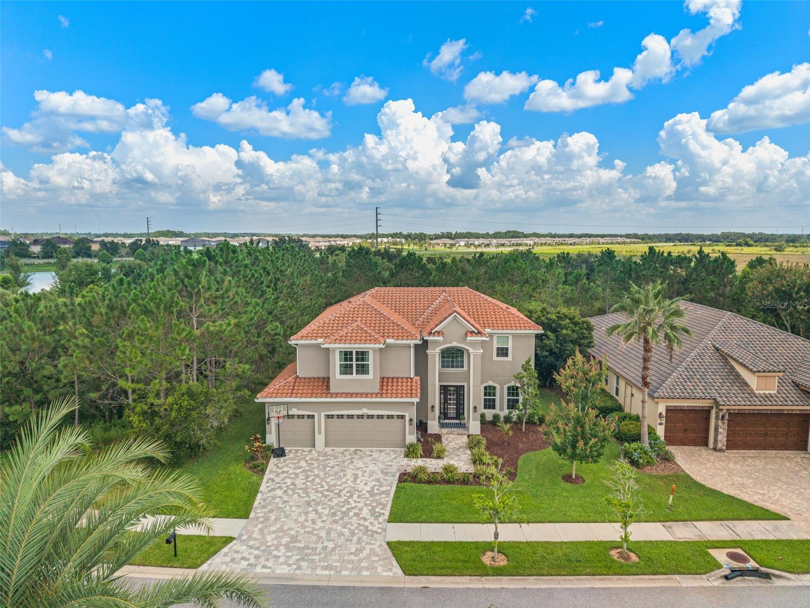 Welcome to 32924 Estate Garden Drive, a stunning home located in the desirable Watercress community in Wesley Chapel. This beautiful 4-bedroom + bonus room, 2.5-bathroom residence is perfectly situated on a peaceful conservation lot, offering scenic views and privacy right in your own backyard.
Upon entering, you’ll be greeted by a grand two-story foyer that creates an immediate sense of space and light. The home is filled with natural light from large windows throughout, making every room feel warm and inviting. The expansive floor plan includes a bright and airy bonus room, ideal for a media room, home office, or playroom.
Designed with both style and function in mind, this home boasts a tile roof and tile flooring in the main living areas, offering a timeless aesthetic and easy maintenance. The spacious 3-car garage provides plenty of storage and parking options.
Upstairs, you’ll find 4 generously sized bedrooms, including a luxurious primary suite that overlooks the tranquil conservation area. The 2.5 bathrooms are tastefully designed with modern finishes, offering comfort and convenience for you and your guests.
Whether you’re enjoying a quiet evening in the backyard or entertaining in the open-concept living area, this home provides the perfect space to make memories. Situated in Watercress, a sought-after community, you’ll have easy access to top-rated schools, shopping, dining, and major highways, all while enjoying the peace and serenity of your conservation view.
The closest elementary schools are WaterGrass Elementary, Thomas Weightman Middle School, Kirkland Academy of Innovation, and more. The WaterGrass Community is full of amenities: multiple pools (including a lap pool and splash pad), a large covered lanai area, a clubhouse with office/meeting areas, tennis courts, basketball courts, playgrounds, and a fitness center. The HOA is just $161/year! This community is located just across the main road from the Epperson Crystal Lagoon, close to Publix at Innovation Springs, and near shopping and restaurants—including KRATE, the outdoor mall. It’s just 35 minutes north of Downtown Tampa, 45 minutes from Tampa International Airport, and about an hour and a half from Orlando & Walt Disney World. Schedule a private tour today! Full list of upgrades available upon request. Video tour available on YouTube and all the social media platforms, search by address. Buyer Tours available 7 days a week. All Buyers must be accompanied by a Licensed Real Estate Agent.