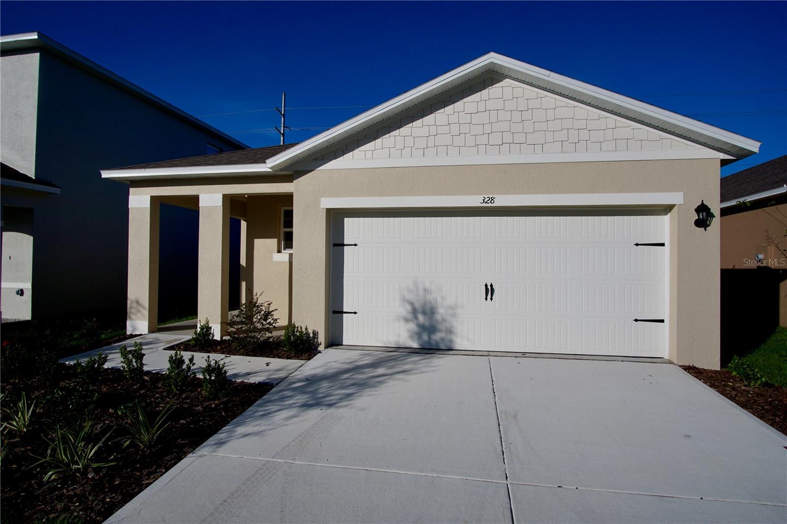 Welcome to Horse Creek at Crosswinds! Conveniently located in the historic district of Davenport, be the first person to live in this newly constructed home. Upon arriving to this charming home you'll find ample parking on the spacious driveway or 2 car garage. To the rear of the home you'll find a scenic backyard and shaded patio area, ideal for enjoying the Florida sunshine! Once you enter the home you'll find brand new paint, flooring, fixtures, and appliances throughout. This home also offers split bedrooms for extra privacy. The kitchen comes fully loaded with matching stainless steel appliances, and plenty of space for both preparing and enjoying meals. The community also has a pool and play area. For more information and showing times please contact our office, this listing won't last long! Property is ready for immediate occupancy!