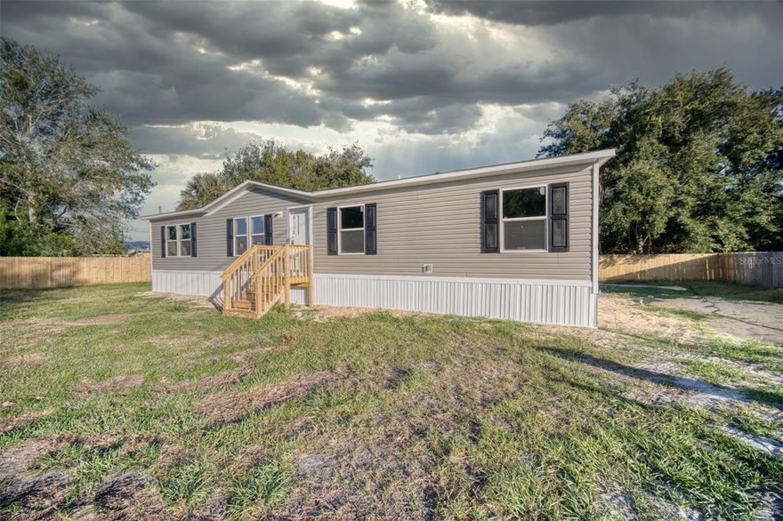 One or more photo(s) has been virtually staged. Step into true new construction living—everything here is fresh and worry-free. This bright 3 bedroom, 2 bath, 1,450 sq ft manufactured home sits on a clean, cleared lot with a large backyard that’s perfect for pets, play, gardens, and gatherings. Inside, natural light fills an open living/dining/kitchen with all new appliances, new cabinetry, and modern finishes, anchored by a private primary suite and a smart split plan. The big-ticket systems are new as well, including the deep well, electrical service, septic upgrades, HVAC/AC, and water heater, delivering peace of mind and lower maintenance from day one. Financing is friendly—ask about FHA, USDA, VA, or Conventional options (buyer to verify program eligibility). Located at 8150 Cherokee Rd in Bartow, you’ll enjoy quick access to Winter Haven/Bartow amenities and commuter routes while coming home to space and quiet. Homes with this level of new systems and a yard this size do not sit—bring your approval letter and see it today.