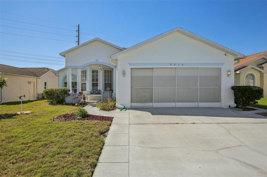 Welcome to this beautifully maintained residence in the desirable Jasmine Trails community of Port Richey, offering a thoughtfully designed split-bedroom floor plan, open-concept living, and seamless indoor-outdoor flow. With approximately 1,515 square feet, this move-in ready home delivers the comfort, functionality, and lifestyle today’s buyers are searching for. Step inside to a light-filled interior with spacious living and dining areas, ideal for both everyday living and entertaining. The heart of the home features a well-appointed kitchen with breakfast area, pantry, and direct connection to the main living space, creating a true open layout feel. The private primary suite is thoughtfully positioned away from the secondary bedrooms and offers a generous layout, en-suite bath, and ample closet space—providing a quiet retreat. Two additional bedrooms and a full bath are located on the opposite side of the home, perfect for guests, family, or a dedicated home office. A convenient interior laundry area and attached garage add everyday practicality. Enjoy Florida living at its finest with a screened-in patio overlooking a private backyard, enhanced by beautifully fruiting trees, including loquat and fig which a rare and desirable feature that adds both charm and lifestyle appeal. Additional highlights include a newer roof (2019), durable construction, and a welcoming front porch entry. Located just minutes from shopping, dining, and major roadways, this home offers the perfect blend of location, value, and move-in ready convenience. A standout opportunity for buyers seeking open layout, split floor plan, outdoor living, and turnkey condition. This home checks all the boxes!