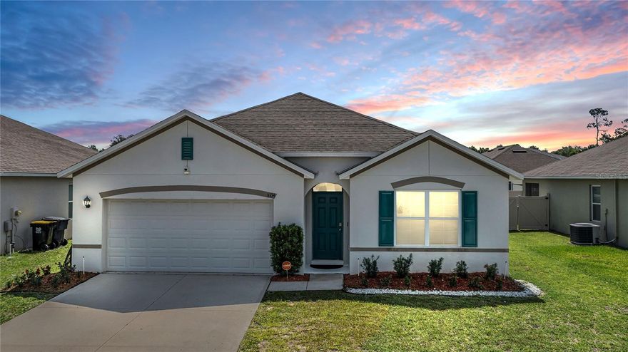 MOVE-IN READY 4 bedroom, 2 bath DR Horton “Cali” smart home in the gated Sereno community of Davenport offering 1,851 sq ft, a 2-car garage, split-bedroom layout, and greenspace behind the home with NO REAR NEIGHBORS. This original-owner home features an open-concept design with ceramic tile in the main living areas, fresh interior paint, neutral finishes, and a bright kitchen overlooking the dining and family rooms with 36" shaker cabinets, laminate countertops, stainless steel appliances, breakfast bar seating, and a walk-in corner pantry. Sliding glass doors open to the covered patio with private backyard views and no rear-facing homes. The owner’s suite is privately positioned off the family room and includes a large walk-in closet, dual-sink adult-height vanity, glass-enclosed shower, water closet, and linen storage. Two secondary bedrooms are located at the front of the home with a shared full bath, while the fourth bedroom offers flexibility for a home office, playroom, guest room, or fitness space. Additional features include an indoor laundry room with washer and dryer included, smart home capability, recently updated HVAC fan motor, new kitchen sink faucet and fresh interior paint. Sereno residents enjoy access to gated entry, resort-style pools, cabanas, playgrounds, walking trails, conservation areas, and convenient access to Hwy 17/92, I-4, Champions Gate, Celebration, shopping, dining, and Central Florida attractions. Located near Mater Academy Charter School and Davenport School of the Arts.