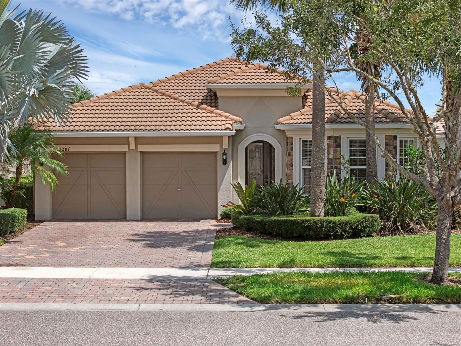 Welcome to your dream waterfront oasis in the heart of Lake Nona! Located in the prestigious guard-gated community of VillageWalk, right across from the USTA National Campus, this stunning single-story POOL home offers the perfect blend of style, comfort, and convenience. Situated on a prime lot with serene water and pool views, this home provides a peaceful atmosphere you can enjoy from the rear screened lanai. The backyard is fully fenced and features a sparkling pool, custom outdoor kitchen, fire pit, and plenty of space for entertaining. Boasting 3 bedrooms, Office, 2 bathrooms, and numerous ADA modifications, this home is fully wheelchair-accessible throughout. The garage has been converted into a climate-controlled bar and media room, perfect for entertaining, but can be restored to its original use if desired. Open floor plan with tile flooring in all main living areas and carpet in two bedrooms, Gourmet kitchen with center island & sink, pantry closet, butler’s area, 42” cabinets, granite countertops, and stainless steel appliances, Separate laundry room with washer & dryer included, Master suite with water views, walk-in closet, double-sink vanity, soaking tub, and separate walk-in shower, Tile roof for lasting durability. VillageWalk offers 24-hour guarded entry plus two additional gated entrances. The community clubhouse features ,Gathering & multipurpose rooms with full-time activity director, Catering kitchen & ballroom, State-of-the-art fitness center, Resort-style pool & lap pool, Tennis & basketball courts, playground, Over 4 miles of walking/biking trails ,On-site gas station, convenience store, beauty salon, and post office. HOA fees includes Complete lawncare, internet, and cable TV. Lake Nona is home to Medical City, UCF Medical School, VA & Nemours Hospitals, Lake Nona Performance Center, Boxi Park, and top-rated restaurants and schools. Easy access to Hwy 417 & 528, Orlando International Airport, Brightline train station, and Central Florida attractions. Once you live here, you won’t want to live anywhere else. Schedule your private showing today!