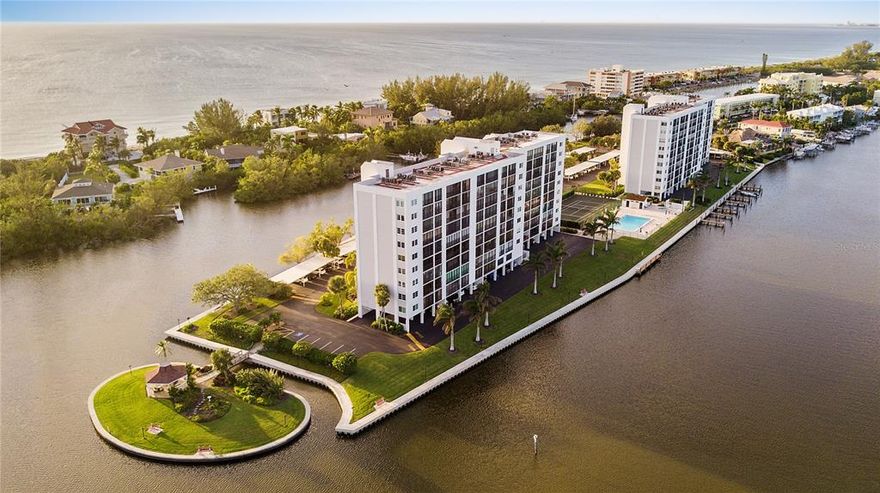 WELCOME TO SIESTA KEY!! This updated turnkey 2 bedroom/2bath top floor PENTHOUSE at The Pointe on Midnight Pass is a private, gated community on a 5-acre peninsula surrounded by water on all three sides with beautiful views. It is located in the south building, FEATURES light oak hardwood floors, granite countertops, brand new backsplash in the kitchen, new sofas, furniture, crown molding, smooth ceilings, fresh interior paint, stainless appliances, washer and dryer, custom plantation shutters, extra on-site storage, and a convenient lobby-access under-building parking space. Air-conditioned lanai has full width sliding glass doors. The Pointe on Midnight Pass is beautifully landscaped and features every amenity you can possibly want: a heated swimming pool and spa, lighted tennis court, private boat docks, kayak and canoe racks and launch, club house with full kitchen, sauna, fitness center and a private island gazebo with bbq grills. Paradise is waiting for you here in Siesta Key, Florida. When you're ready to live the ISLAND LIFESTYLE you've always dreamed of, call me for your private tour today.