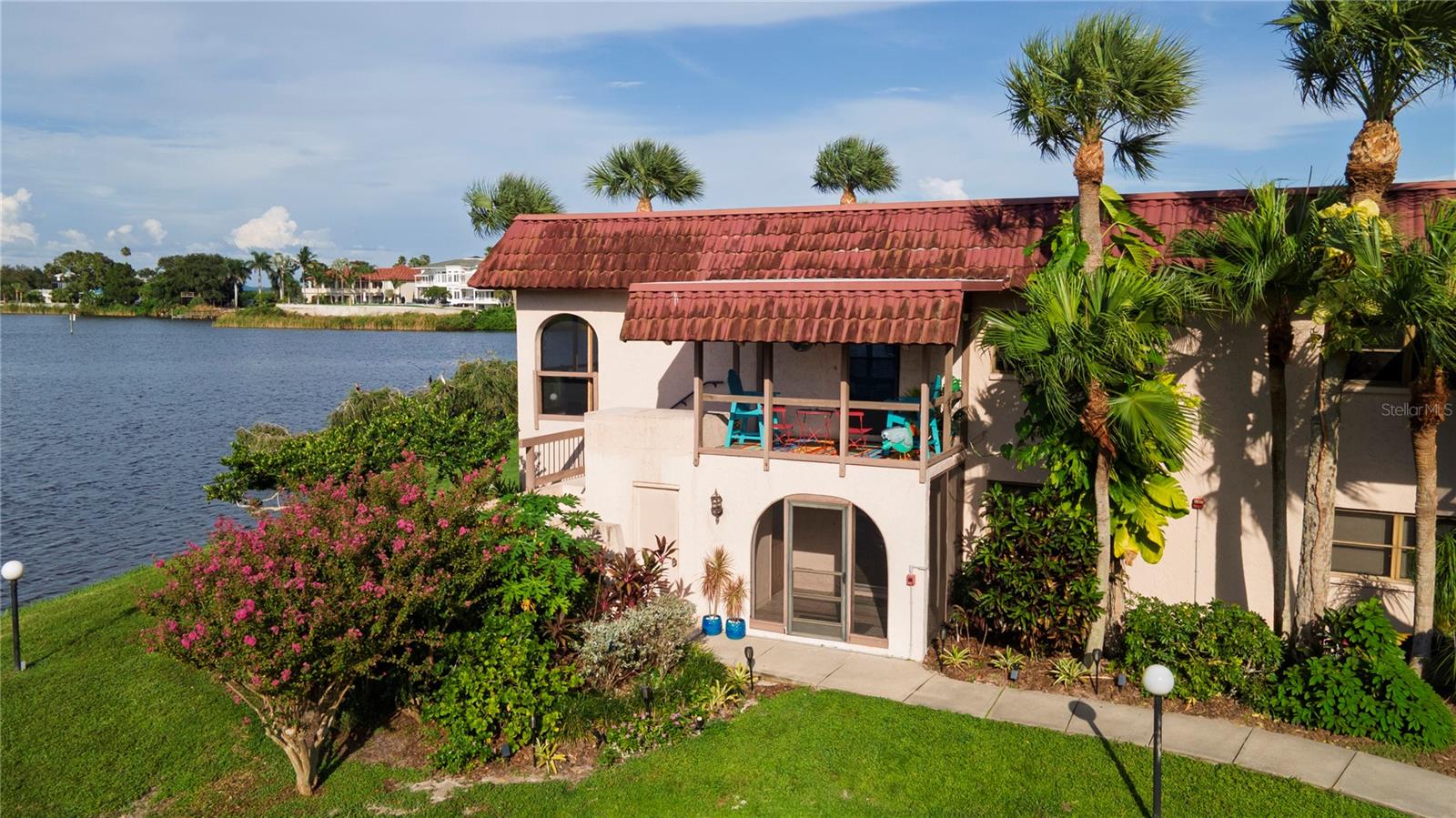 Experience OLD FLORIDA charm in the coveted waterfront community of SANDAL COVE! Nestled along iconic Bayshore Blvd., this 1-bedroom, 1-bath ground-floor retreat offers lush landscaping, a sparkling community pool, and tranquil lake views from your rear lanai. Ream Wilson Trail is located just across the street. Historic downtown SAFETY HARBOR and the world-renowned SAFETY HARBOR RESORT & SPA are just 1 mile away. What a beautifully secluded location & a MUST SEE for any photographer/journalist! Inside, a spacious open layout flows seamlessly from the living/dining area to a remodeled European-style kitchen featuring a custom island & soft-close cabinetry. Luxury vinyl tile flooring is installed throughout; (ceramic plank tile in both bath & lanai). The primary bedroom features a huge walk-in closet providing maximum storage & a large window with picturesque views. For your convenience, there is also an interior utility closet that can be outfitted with a washer/dryer, however, a community coin operated laundry facility is also available in the center of each building. Whether a full-time haven or second home, this is the CAREFREE COASTAL LIFESTYLE you’ve been dreaming about. Schedule your private showing today!