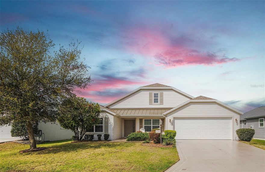 Beautifully positioned in the sought-after Village of Pine Hills, this 2016 designer Putnam model offers the perfect blend of modern construction, spacious design, and effortless Florida living. Featuring 4 bedrooms, 2 baths, and an oversized 28’ deep by 21’ wide garage with epoxy floors, this home delivers both function and style with room to truly live and entertain.  NO BOND !!   ROOF 2024 !! Check out the walk-through tour by clicking on the TOUR link above ! 

From the moment you arrive, you’ll appreciate the clean lines and newer build quality, while inside, volume ceilings and an open-concept layout create a light, airy feel throughout the main living spaces. The seamless flow between the living room, dining area, and kitchen makes everyday living comfortable and gatherings easy. The kitchen offers abundant cabinetry and workspace, along with a charming eat-in nook—perfect for morning coffee or casual dining.

There is no carpeting in the home, providing a clean, cohesive look and low-maintenance living throughout. Just beyond the main living area, the enclosed lanai with air conditioning expands your living space year-round, creating an ideal setting for relaxing, entertaining, or enjoying quiet evenings in comfort regardless of the season.

The primary suite is generously sized, offering ample space for a sitting area or home office. The ensuite bathroom is equally impressive with dual vanities, a large walk-in Roman-style tiled shower with built-in bench seating, and a spacious walk-in closet designed for optimal organization.

The additional bedrooms provide flexibility for guests, hobbies, or workspace, making this home as versatile as it is inviting.

Living in the Village of Pine Hills places you in one of the newer and most desirable areas of The Villages, surrounded by scenic preserves and beautifully maintained landscapes. Residents enjoy close proximity to championship and executive golf courses, nearby recreation centers, walking and biking paths, and easy access to the vibrant lifestyle offerings of Brownwood Paddock Square, including shopping, dining, and nightly entertainment. The area also provides convenient access to the growing amenities along the southern corridor, making Pine Hills an ideal location for both tranquility and connectivity.

This is a home that combines newer construction, thoughtful design, and a prime location—ready to be enjoyed from the moment you arrive.