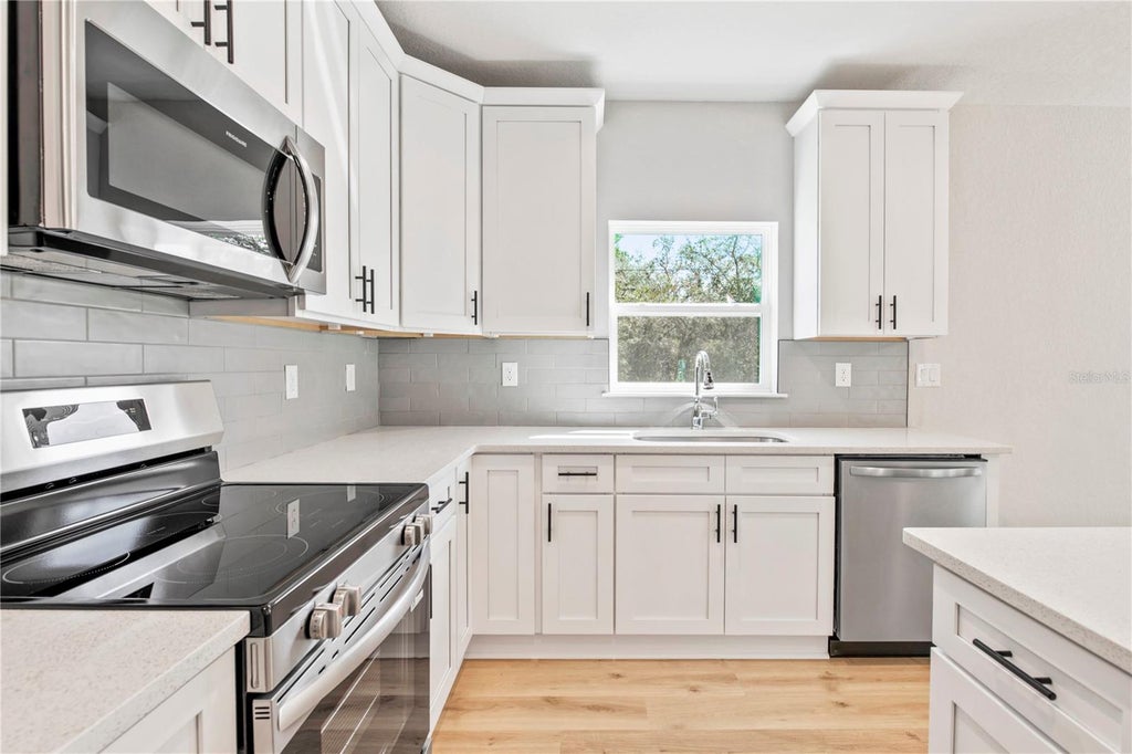 Photo of 13290 Snowy Plover Avenue, Weeki Wachee, FL 34614 (MLS # TB8558737)