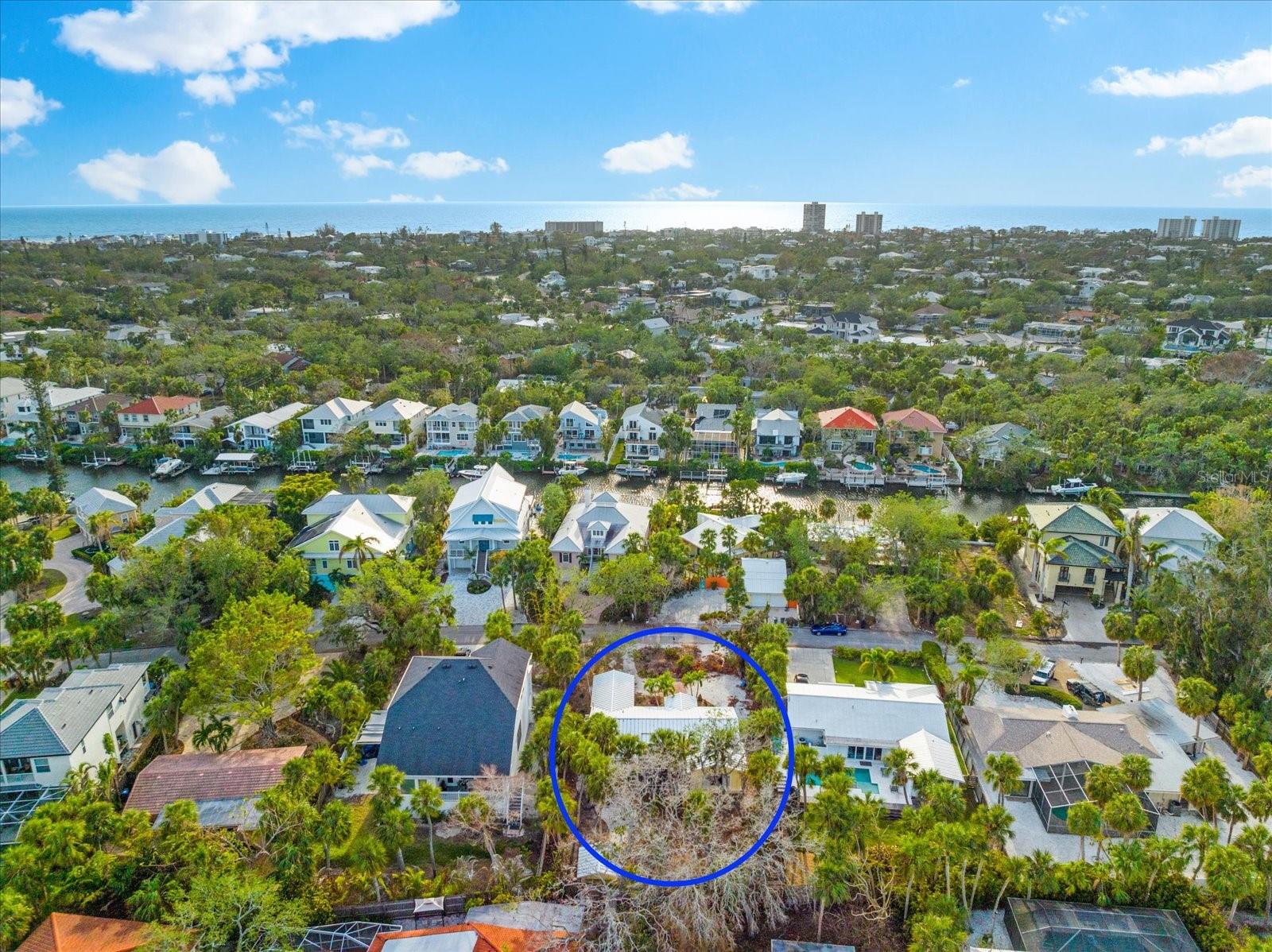 A Rare Build Opportunity on Siesta Key! Located on one of Siesta Key’s most beloved streets, this .26-acre lot on Commonwealth Drive presents a unique opportunity to build new in an established, multi-million-dollar neighborhood. Surrounded by lush, mature landscaping and a peaceful, community-focused setting, the lot offers the ideal backdrop for your vision—whether you’re seeking a full-time residence, vacation retreat, or long-term investment. The existing cottage, which holds no contributory value due to hurricane flooding, creates a true blank slate for new construction. As an added benefit, this property is being offered with the option to build a thoughtfully designed custom home by Yoder Construction. The proposed plan, The Oceana, is part of an exclusive ISLAND SERIES, developed with sustainability and the unique coastal conditions of Siesta Key in mind. Buyers may choose to build this elevated 2,735-square-foot home, or collaborate with the builder on a personalized design through the available design center. Commonwealth Drive is ideally located just minutes from the powdery sands of Siesta Key Beach and the vibrant charm of Siesta Village, with its shops, restaurants, and island lifestyle. Opportunities to build new in this highly sought-after location are increasingly rare. To explore this offering further, request details on the optional build package, and schedule a walk of the lot.
