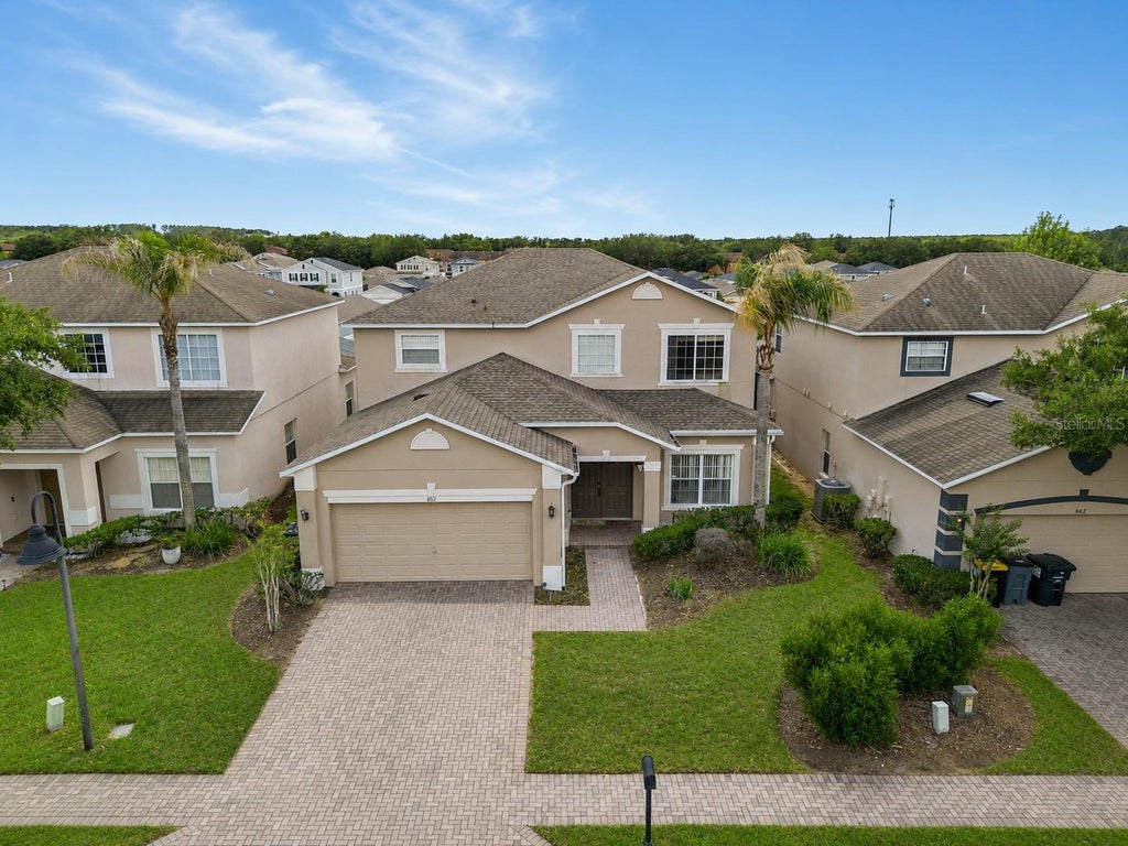 Photo of 652 Highgate Park Boulevard, Davenport, FL 33897 (MLS # O6415440)