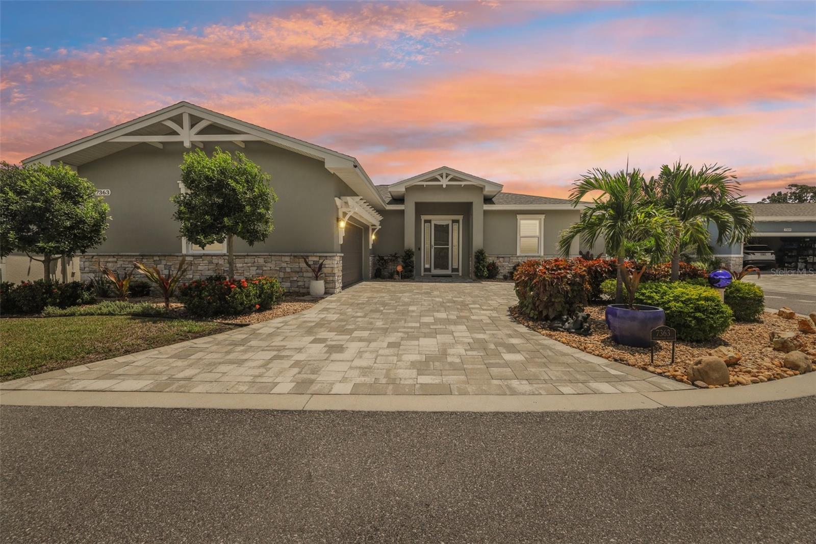 Looking for a new construction home in a non-flood zone just minutes to the beaches? Look no further than this beauty by Chouinard Builders, built in 2023 and practically brand new!
Located in the private Estates at Ridgewood community in Seminole, this 3-bedroom, 2-bath residence offers 2,003 sq. ft. of thoughtfully designed living space in a split-bedroom, open-concept layout.
From the moment you step through the 8-foot entry door, you’ll be greeted by soaring 10-foot ceilings, elegant tray ceilings, and beautiful tile floors that flow throughout. The heart of the home is the chef-inspired kitchen, showcasing luxury quartz countertops, custom all-wood cabinetry with crown molding, under-cabinet lighting, and a designer wood feature under the oversized 12.5-foot island. A full stainless steel Frigidaire appliance package (2023), large walk-in pantry, contemporary pendant lighting, and stylish backsplash complete the space—perfect for cooking and entertaining.
The private owner’s retreat is your personal sanctuary, featuring a spacious walk-in closet and a spa-like bath with dual vanities topped with quartz, a custom-tiled glass shower with multiple heads—including a rain shower—and elegant custom cabinetry. Two generously sized guest rooms share a stunning upgraded bathroom with designer finishes and quartz countertops.
Step outside through double French doors to your screened-in paver patio with a built-in sunshade, perfect for enjoying Florida evenings in comfort. The exterior impresses with a paver circle driveway, professionally landscaped yard with reclaimed irrigation, and a hurricane-rated garage door.
Additional upgrades include: plantation shutters throughout, hurricane-impact windows and doors, water softener, can lighting and ceiling fans in every room, built-in Blink doorbell with exterior cameras, an expansive laundry room with quartz counters, utility sink, and custom cabinetry. Roof, HVAC, and hot water heater were all brand new in 2023, ensuring years of worry-free living.
With low HOA fees, this home offers the best of Seminole living. Walk to Seminole City Park, enjoy nearby tennis courts, or explore the vibrant Seminole City Center’s shopping, dining, and entertainment.
This is more than a home—it’s a lifestyle. Schedule your private tour today.