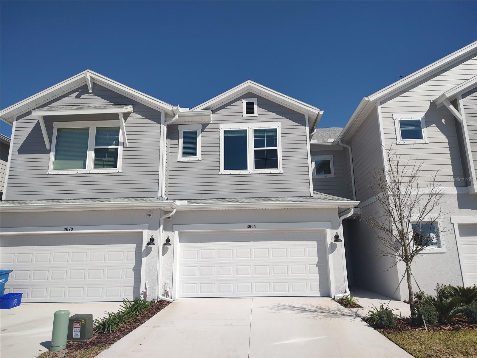 n Welcome to luxury living in the Bexley Community of Land O Lakes. This brand new, exceptional three bedroom, two and a half bathroom luxury townhome has never been occupied. The townhome boasts an open and bright floor plan that welcomes you from the moment you step inside. The first level is adorned with bright wood laminate flooring, creating a warm and inviting atmosphere. The tasteful kitchen resting at the heart of this home is a chef's dream. It features a gas cooktop, built-in oven, built-in microwave, large island and quartz countertops to create a perfect blend of style, luxury and functionality. The home is also equipped with a tankless gas water heater so you'll never run out of hot water. As you ascend to the upper level, plush carpeting awaits in the three bedrooms, adding comfort and coziness to the living spaces. The primary suite is a true retreat, featuring a tray ceiling, a park view, a large ensuite designer bathroom with a double vanity, a separate water closet for privacy, a power showerhead and a frameless, glass walk-in shower. The spacious deluxe walk-in closet compliments your private retreat's touch of luxury. The secondary bedrooms offer plenty of living space to support growing minds and personalities. For added convenience, a washer and dryer are included upstairs, making daily chores a breeze. The two car garage is another standout feature with a gorgeous glitter epoxy finish, elevating both style and durability. This townhome not only offers a great living experience but also grants access to an abundance of amenities and lifestyle that the Bexley Community is known for. Enjoy a wide variety of recreational and social amenities featuring seven unique parks including a bark park for dogs, multiple playgrounds, hiking and biking trails with a BMX pump track and outdoor fitness stations. Your automatic membership in the Bexley Club includes relaxing indoor and outdoor fireplaces, a lakeside view patio, an indoor fitness center, a swim club, three resort style pools, a lap pool, a splash pool and the popular Twisted Sprocket Cafe! The community is zoned for highly rated Bexley Elementary, Charles S. Rushe Middle, and Sunlake High Schools. There's a Montessori School and Goddard School Early Childhood Development Center. Plenty of shopping destinations, new restaurants and places of worship are nearby. It is conveniently located near major highways for a quick commute to Tampa International Airport, downtown Tampa, midtown Tampa and Florida's famous sandy beaches. Pets are welcome at the owner's discretion - one pet, 25 lbs max. Vacant/Available Now!