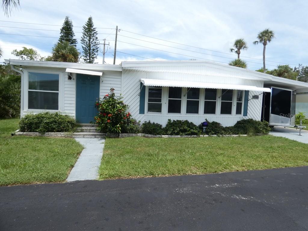 3 Bedroom, 2 Full Bathrooms, This Home has been Completely, Professionally Rehab with Class, Oversized 1 Car Carport. Giant Laundry Room/Workshop. All New Double Pane Windows. 3 New Split AC units in this home, 2025 Appliances, All New Cabinets, No Carpet, Top of the line Granite with True Jacuzzi Tub, Private Sidewalk from the Front to the Rear, This Home is Magnificent, We Dare you to View this Home:) No Rear Neighbor, Large Space between your Neighbors on Each Side. The Clubhouse is Beautiful, pool shuffleboard, bocce ball area. Pool table in the clubhouse, Huge kitchen gas grill, Pond view very clean, comfortable relaxing resort like feeling. Less than 43 miles to St. Pete Beach In Florida was just named The #1 Beach in America and the Fifth Best Beach in The World. Please view two videos: Tour 1 & Tour 2