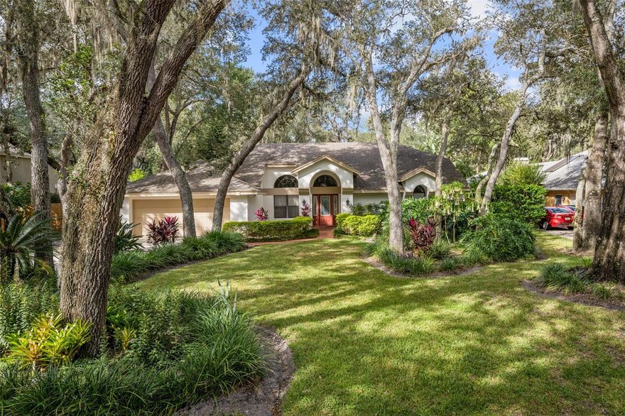 Nestled on a mature, tree-lined street in the Oviedo community of Huntington you will find this beautiful 4 bedroom, 3 bathroom home that is ready to welcome a new family! Lush, mature and tropical landscaping, oversized driveway, and neutral exterior paint greet you upon approach. Once inside, you are welcomed by tall ceilings, neutral paint and flooring, and tons of natural lighting that streams through the large windows and sliders. The formal dining room is located off the left side of the front door and a spacious formal living room, located adjacently, offers backyard views and access via sliding doors that make indoor/outdoor living a breeze. A spacious combination kitchen and family room provided the perfect place for entertaining and gathering as a family. The kitchen offers granite countertops, stainless appliances, updated cabinetry, and island/breakfast bar combo that overlooks a dinette. The spacious family room is complete with vaulted ceiling, wood-burning fireplace, built-ins, and sliding doors that open to the patio. The home has a triple-split floorplan with the master off the front of the home, two bedrooms and bathrooms off the left side, and one a bedroom and bathroom off the back. The master suite is large with ceiling fan, sliding doors to the patio, walk-in closet, and en-suite bathroom, complete with upgraded, double-sink vanity with added storage, garden tub, an updated shower with built-in bench and frameless glass. A barn door separates the two secondary bedrooms and bathroom from the main living areas, offering privacy and a noise barrier. Both bedrooms are good size with large closets and the secondary bathroom offers an oversized, single-sink vanity and shower/tub combo. The bedroom and bathroom off the back of the home make a great guest suite or is perfect for multi-generational living. The spacious bedroom had its own private bathroom, which offers a single-sink vanity, tile shower, and pool access. Out back, a spacious pool deck provided a great space for entertaining. A coveted area is located up next to the home and overlooks a large private pool with water feature, all of which is under screen enclosure. This overlooks a huge, fenced backyard with tons of mature landscaping and a shed for all your storage needs. Don’t miss out on your chance to call this beautiful family home your own!