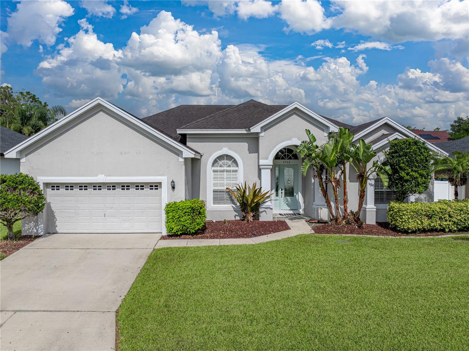 Absolutely stunning 4BR/3BA pool home! Upon entry, you will find gorgeous bamboo flooring throughout the entire home with tile in the bathrooms and laundry room. To your left through glass french doors, you find the Office with a barn door that will lead you into the Kitchen. To your right, you will enter the Primary Bedroom, which includes sliders to the pool, and an En Suite bathroom, complete with dual walk-in closets, two separate vanities, a garden tub, and walk-in shower with waterfall showerhead. Moving into the home, you find yourself in the formal Dining room which could easily be used as a formal Living room. The Dining room space is perfect for all those holiday gatherings with sliders leading you out back. As you make your way into the Kitchen you will find four stainless steel appliance package by LG, solid wood cabinets, breakfast bar, stone counters, and eat-in nook. So much light floods the kitchen and great room! The heart of the this home flows into the Great room creating the ideal space for entertaining and those fun family game nights. Off the Great Room you will find three additional bedrooms and two additional full bathrooms. The garage conversion makes a great alternative space for family fun. The pool offers an oasis whether it’s for your morning coffee, evening cocktail, or weekend fun and barbecues! Multiple upgrades through out just to name a few include : New pool heater & pool pump 2020, pool resurfaced with new tile 2021, office enclosure 2022, garbage disposal 2023, HVAC 2024. Located close to shopping, dining, travel, and entertainment, this home is move-in ready today.