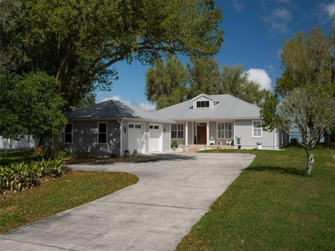 Photo of 12495 SE Sunset Harbor Road, Weirsdale, FL 32195 (MLS # OM723211)