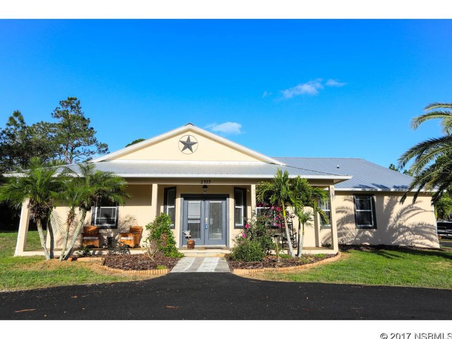 Charming in town horse farm pool home with 5.22 acres just minutes to the beach! Custom built home with an open split floor plan, beautiful open gourmet kitchen with granite, large center island and gorgeous wood cabinets. Lots of decorator touches appointed in this home starting with the Travertine tile and brazillian cherry hardwood floors. It is a must see! Two master suites on the first floor and another bedroom up the stairs from the kitchen. Frech doors lead to a private covered deck and pool area perfect to relax in the evening or have your morning coffee.  New circlular driveway, 645 sq ft garage with workbench space. Excellent appeal the minute you pull up to the house, charming exterior and metal roof. This house is a showplace, you will love it the minute you see it. Ready for it's new owner. ;Water: City