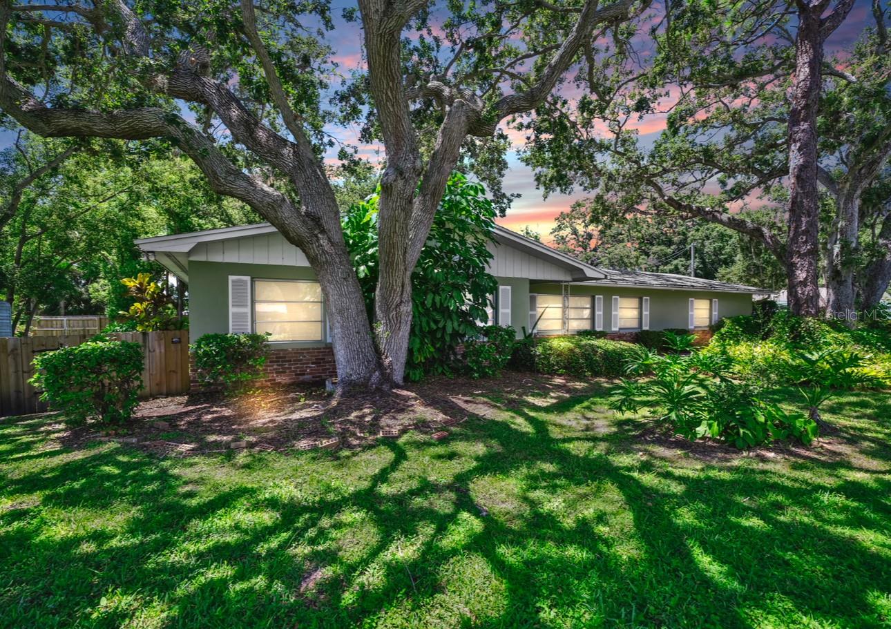 Discover Your Dream Retreat in Dunedin
Welcome to an oasis of tranquility and potential in the vibrant community of Dunedin, Florida. Nestled on an expansive 0.65-acre lot, this property presents a rare opportunity to create a personalized paradise. With close proximity to the energetic heart of downtown Dunedin and the world-renowned Clearwater Beach, you’ll find yourself at the crossroads of convenience and serene living.
The property boasts a park-like setting with ample space for all your adventures and dreams. Behind the secure fencing lies a vast area perfect for parking your RV, boat, or other recreational vehicles. Imagine the endless possibilities—there’s plenty of room to construct that dream pool or an outdoor kitchen while still maintaining a lush green lawn.
A Property With Endless Potential
Step inside the main house, where spaciousness and comfort blend seamlessly in this charming 3-bedroom, 2-bathroom home. As you explore further, you’ll discover a unique feature that sets this property apart—a separate 1-bedroom, 1-bathroom apartment, conveniently connected by a breezeway. With its own entrance, central heating and air conditioning, and private porch and backyard, this apartment offers endless potential. Whether it serves as the ideal in-law suite, a private guest retreat, or transforms into a lucrative rental unit, your options are plentiful.
Location, Location, Location
One of the standout features of this property is its prime location. Just a short bike ride or walk away, you’ll access the splendid Pinellas Trail system—an outdoor enthusiast’s dream. Whether you’re commuting to Tampa International Airport, a 30-minute drive, or craving the fantastic dining and entertainment options in Dunedin and Clearwater, this location doesn’t disappoint.
Perfect for Multigenerational Living or Income Generation
Diverse needs meet this home’s versatile spaces perfectly. It’s ideal for multigenerational families who appreciate privacy and connectivity or those seeking additional rental income. Envision hosting friends and family in the spacious apartment or generating a steady income stream from long-term tenants or vacation rentals.
Unveil Your Creativity
This is more than just a home; it’s a canvas for your creativity and aspirations. With generous outdoor and indoor spaces, you can bring your vision to life, designing a personalized sanctuary that suits your lifestyle and preferences. Whether that involves lush gardens, artistic studios, or entertainment hubs, this property is yours to mold.
Ready to experience firsthand what makes this property truly special? Schedule a showing today and explore how you can transform this sizeable lot into your haven in Dunedin’s thriving community.
