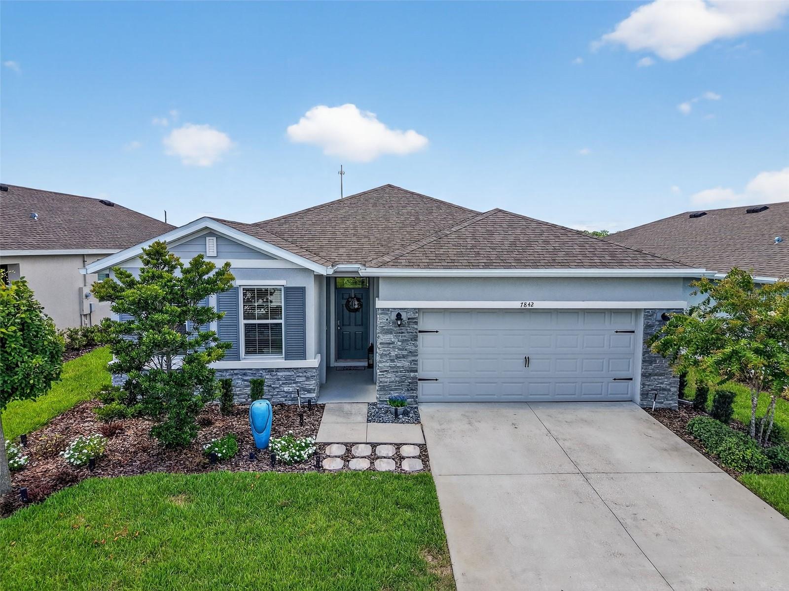 Welcome to this beautifully maintained 4-bedroom, 2-bathroom home located in the family-friendly Beaumont community! Step inside to an open-concept layout featuring tile flooring, a spacious living area, and a modern kitchen. The kitchen features granite countertops, tile backsplash, stainless steel appliances, and a large island perfect for entertaining! The split-bedroom floor plan offers privacy, with a spacious primary suite complete with a walk-in closet and en-suite bathroom featuring dual vanities and a walk-in shower. Three additional bedrooms provide ample space for family, guests, or a home office. All bedrooms, living space, and lanai have ceiling fans by remote. Outside, enjoy a quiet backyard with a screened lanai – ideal for morning coffee or winding down after a long day. NO REAR NEIGHBORS! The community features a resort style pool, fitness center, pickleball courts, bocce ball and walking trail for your enjoyment along with golf cart access to The Villages. Incredible location with access to new shopping and dining options—Target, Lowe’s, Home Depot, Publix, and much more! Close to The Villages Brownwood Paddock Square and downtown Wildwood!