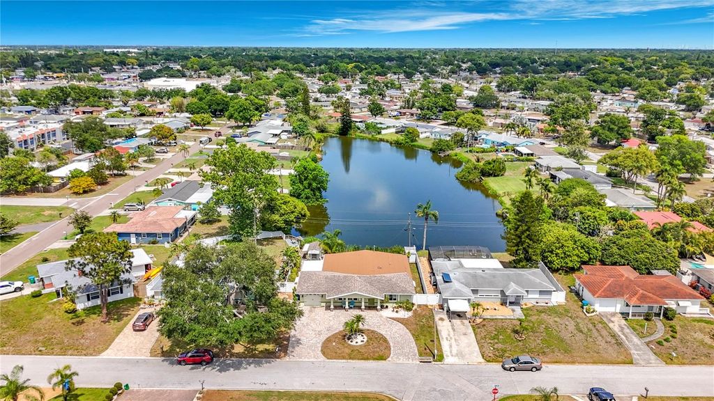 Photo of 5163 60th Way N, Kenneth City, FL 33709 (MLS # TB8511346)