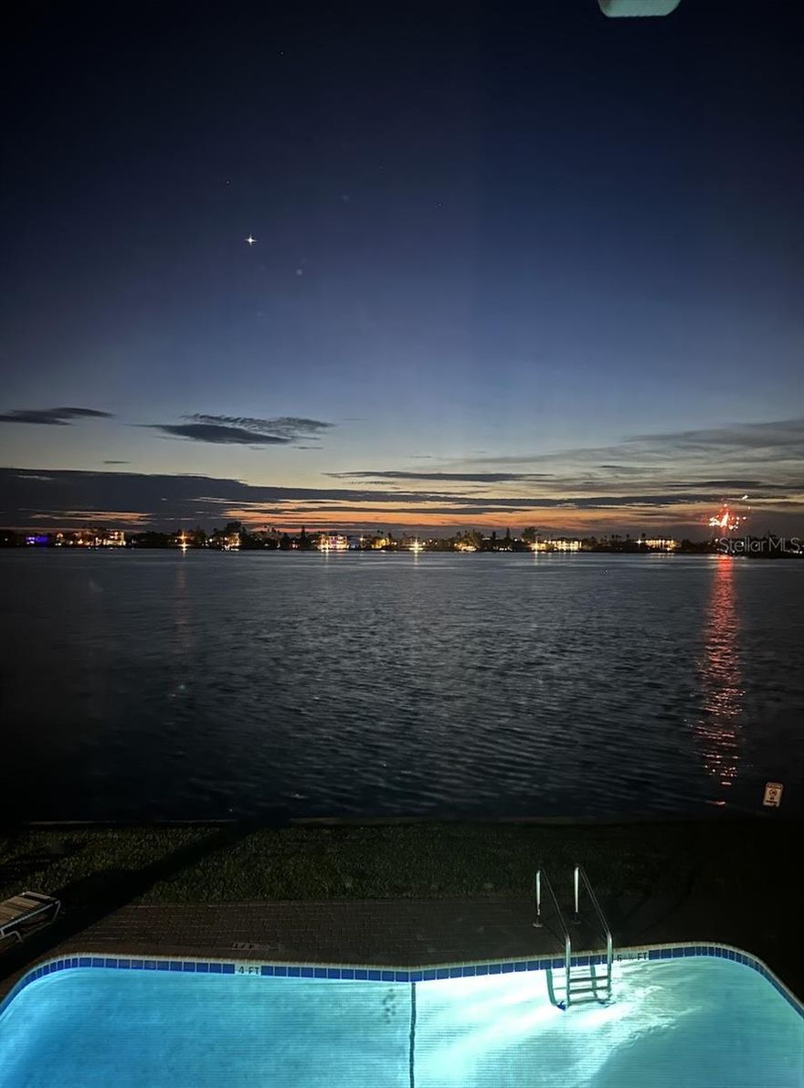 Don’t miss this rare opportunity for LUXURY WATERFRONT LIVING! Exceptional Top-Floor Condo with PANORAMIC WATER VIEWS. Discover this truly one-of-a-kind, nearly 2,000 sq. ft. residence overlooking the Pass-A-Grille channel. COMPLETELY RENOVATED with thoughtful upgrades throughout, this spacious home blends luxury, comfort, and peace of mind. Step into a bright open layout designed for both entertaining and everyday living. The chef’s kitchen features soft-close cabinetry, granite counters, and GE appliances with transferable warranty. Enjoy multiple living and dining areas, a spacious laundry room, and a flexible den/office space. The home offers travertine flooring throughout, hurricane-rated windows and doors and THREE FULL EN-SUITE BEDROOMS, including a newly renovated bathroom in the primary bedroom, plus generous walk-in closets. Open your sliding glass doors to a screened lanai and take in endless views of dolphins, stingrays, and passing boats. The inviting outdoor space creates the perfect setting for relaxation or hosting family and friends. Additional perks include two under-roof dedicated parking spots, two storage closets on the second floor, and condo fees have remained stable for over two years. This TOP-FLOOR SANCTUARY combines modern upgrades, breathtaking views, and resort-style amenities in a community that continues to invest in its future. Motivated seller offering to pay for 1 full year of condo fees.