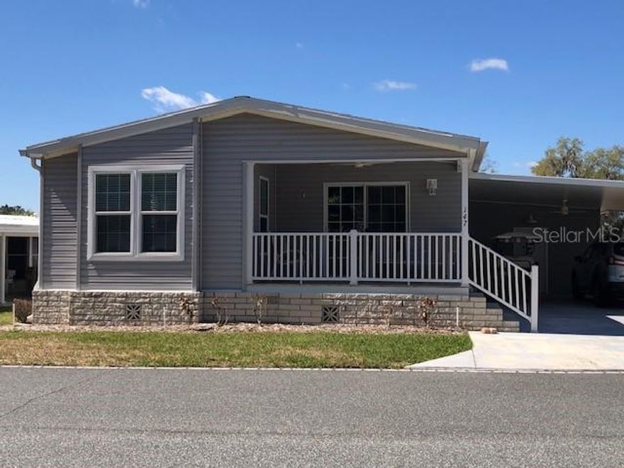 PROFESSIONAL MEDIA COMING SOON.  This 2020 home is LIKE NEW and has been IMPECCABLY MAINTAINED. LUXURY VINYL PLANK FLOORS throughout make the LIVING EASY
and an OPEN FLOOR PLAN lends a feeling of SPACIOUSNESS and COMFORT. KITCHEN appliances are STAINLESS STEEL and there are
AMPLE CABINETS and COUNTER SPACE. There are CEILING FANS placed strategically in the home, crown molding and a neutral color
scheme. The PRIMARY BEDROOM has an EN SUITE with DUAL SINKS, SHOWER with a BUILT-IN BENCH, COMFORT-HEIGHT COUNTER &
TOILET, and a WINDOW for NATURAL LIGHT. There are TWO ADDITIONAL BEDROOMS for GUESTS, AN OFFICE, TV ROOM or extra
STORAGE ~ whatever you like! UPGRADES TO THIS MODEL INCLUDE: DOUBLE-PANE WINDOWS, SLIDING DOOR FRONT OF HOME,
and some BULLNOSE CORNERS. The OVERSIZED CARPORT has space for CARS and a GOLF CART, too, plus a LARGE STORAGE SHED
WITH STEEL SHELVING (Fridge and portable shelving in shed do not convey). HAWTHORNE is a PREMIER manufactured home CO-OP
COMMUNITY with a plethora of AMENITIES, ACTIVITIES AND CLUBS. Included in the monthly fee are: 24-HOUR GUARDED GATE, CABLE,
WATER, SEWER, COMMUNITY FACILITIES USE, ACCESS to HARRIS CHAIN of lakes, A BOAT SLIP, DOCK, MARINA, POOL, TENNIS &
PICKLEBALL COURTS, & so MUCH MORE! See attachments for comprehensive list/details.