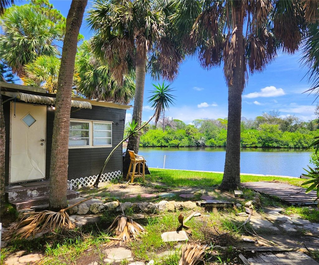 Photo of 6977 Edgewater Drive, New Port Richey, FL 34652 (MLS # TB8409516)