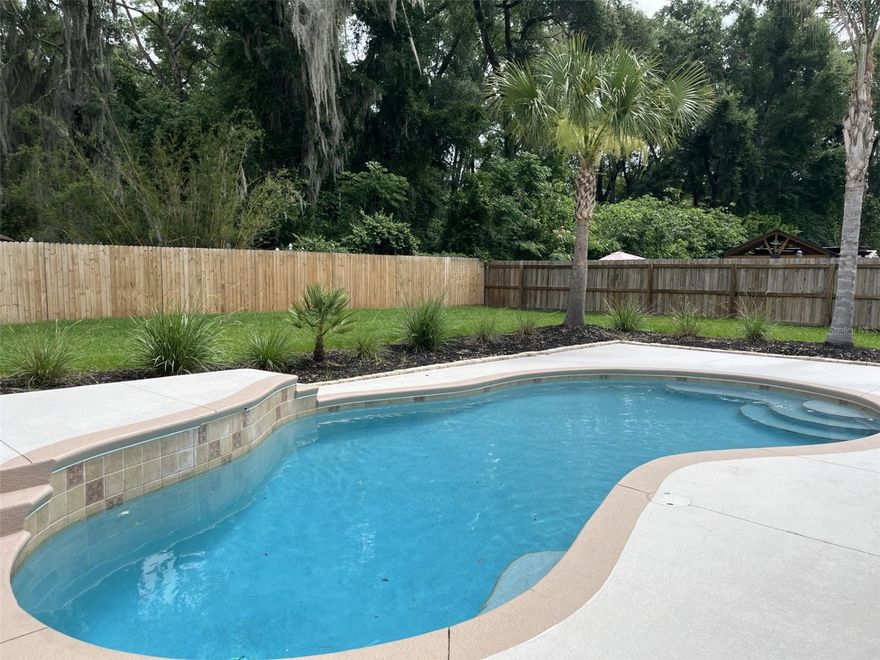 Welcome to Hidden Grove, one of Belleview's desirable gated communities offering privacy, convenience, and a low HOA of just $50 a month. This beautifully maintained 3-bedroom, 2-bath home with a versatile bonus room/den provides over 2,000 square feet of living space designed for comfortable everyday living and entertaining.

Step inside to discover a thoughtfully updated interior featuring spacious living areas and a flexible floor plan that can easily accommodate a home office, playroom, hobby room, or guest space. The split-bedroom layout offers privacy for family members and visitors alike. Enjoy the new quartz counter tops and appliances!!

Outside, your private backyard retreat awaits. Enjoy Florida living year-round in the sparkling kidney-shaped in-ground pool, complete with a solar heating system for extended seasonal enjoyment. The fully fenced yard offers plenty of space for a growing family, pets, gardening, or outdoor gatherings on the generous .26-acre lot.

Major updates provide peace of mind, including a newer HVAC system and a roof that is only three years old. Additional features include a 2-car garage, 2,061 square feet of living area, and 2,544 square feet under roof.

Perfect for growing families seeking more space or seniors looking for a move-in-ready home with room for guests and hobbies, this Hidden Grove gem combines comfort, value, and an exceptional lifestyle. Schedule your private showing today!